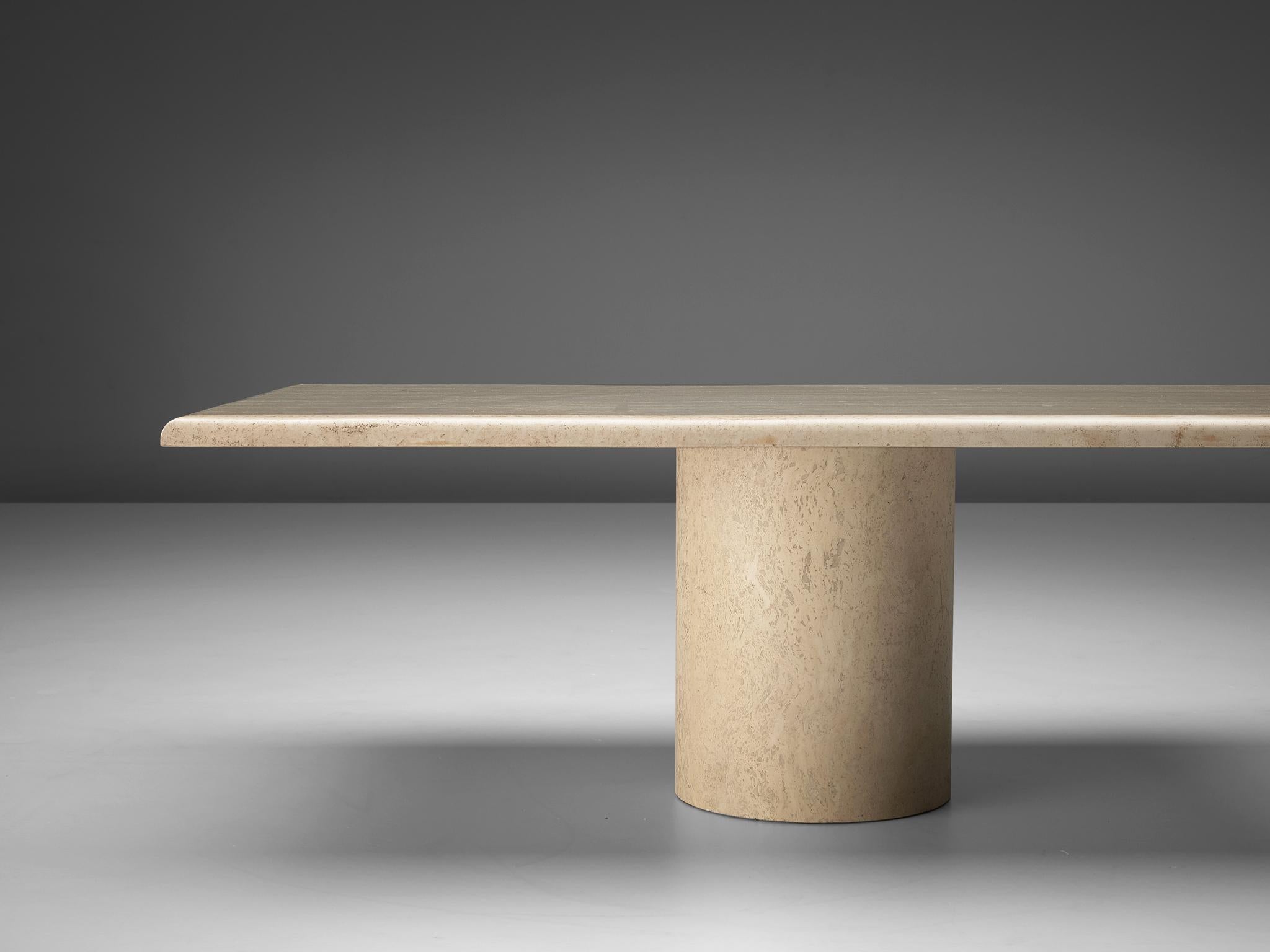 Coffee table, travertine, Italy, 1970s

With a travertine angular tabletop and a strong cylindric travertine base this pedestal coffee table shows a minimalistic design. The bright travertine gives the table a sculptural look. The natural layers