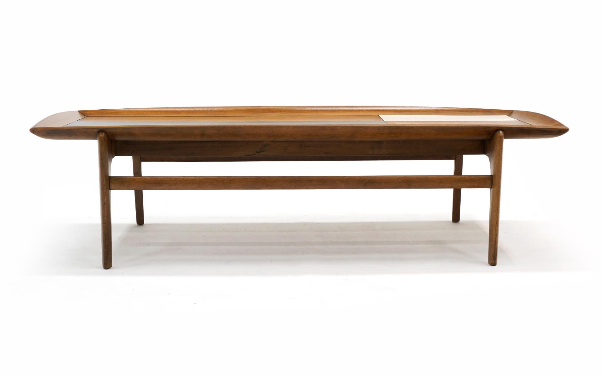 Brown Saltman coffee table in beautiful original condition. Rectangular in shape with white and black lacquered accents. Raised edges and nice sculptural detail on the base. Classic mid century table in it's original untouched condition.