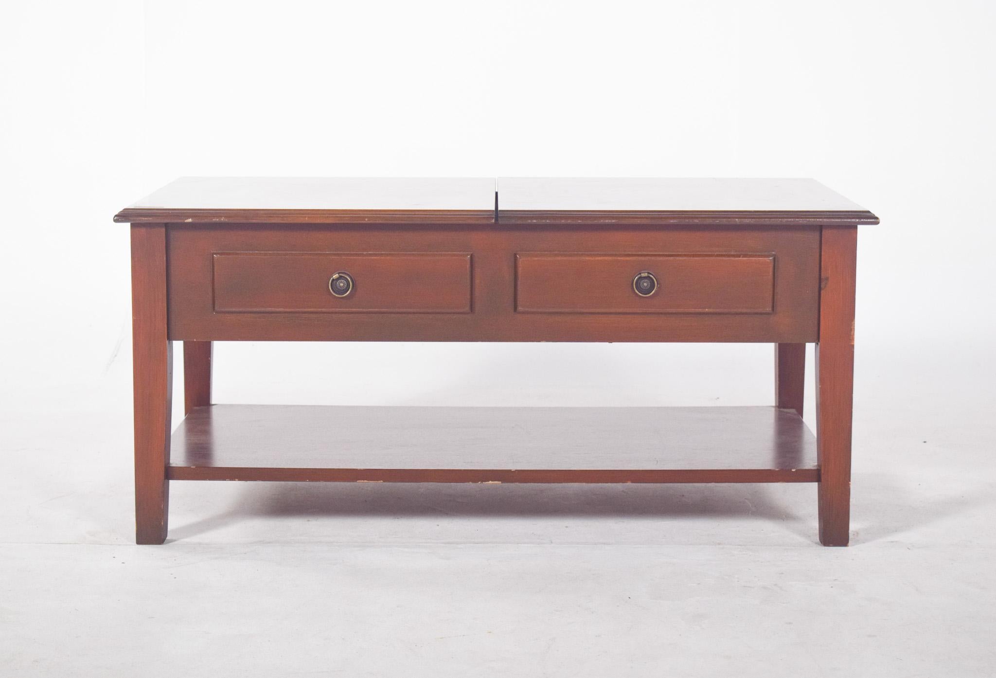Coffee table, with hinged top. With a robust rectangular structure and a simple but elegant finish, the top is divided into two hinged lids that open to reveal an internal compartment divided into squares, ideal for storing various objects. Each
