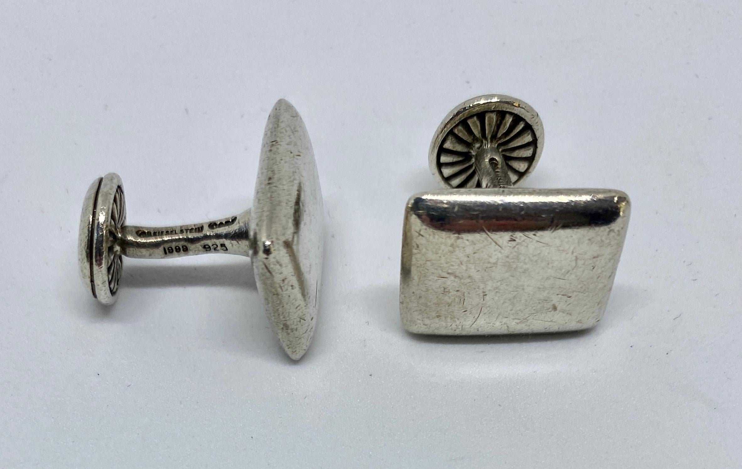 Classic, rugged, highly collectible cufflinks suitable for business and casual occasions by Barry Kieselstein-Cord.

The cufflinks have rustic rectangular faces measuring 19.1 by 14.9 mm, backed with circular discs featuring the immediately