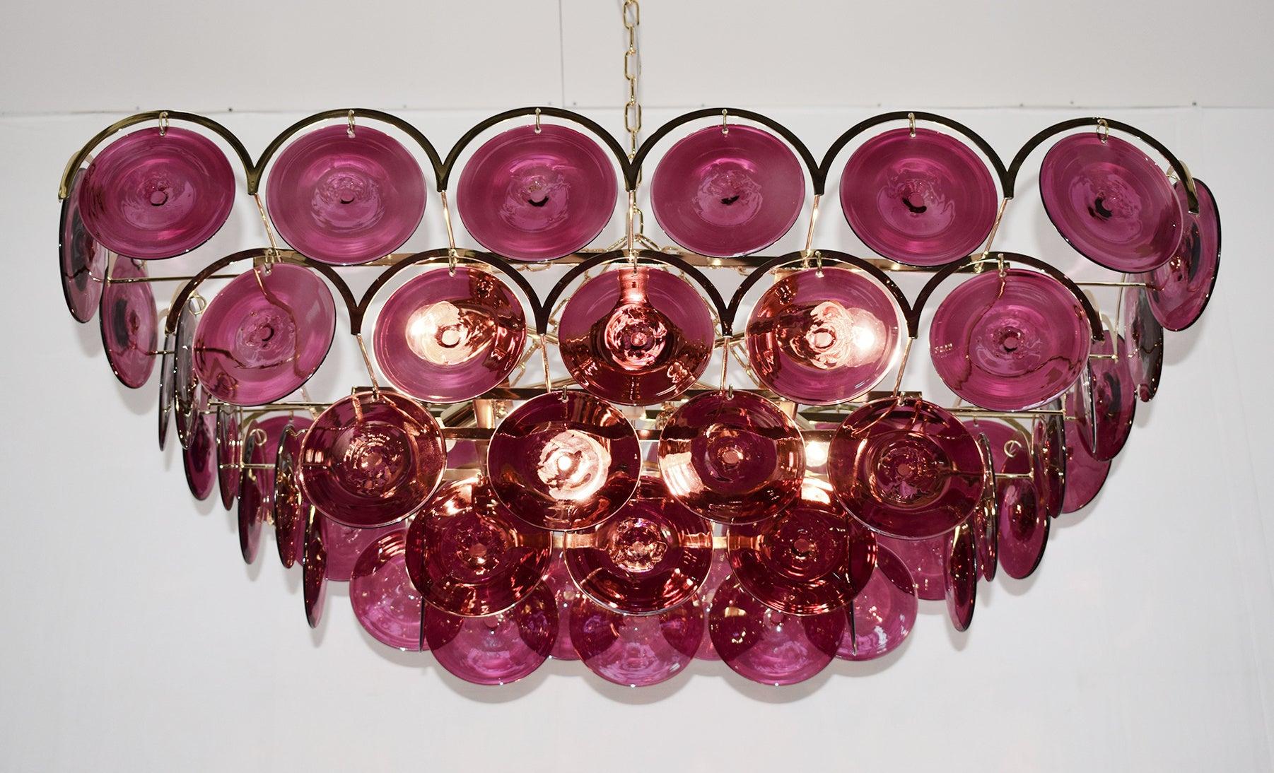 Italian chandelier with burgundy colored hand blown Murano glass discs mounted on 24-karat gold-plated metal frame with decorative arch details, by Fabio Ltd, made in Italy
6 lights / E26 or E27 type / max 60W each
Measures: Length 37.5 inches,
