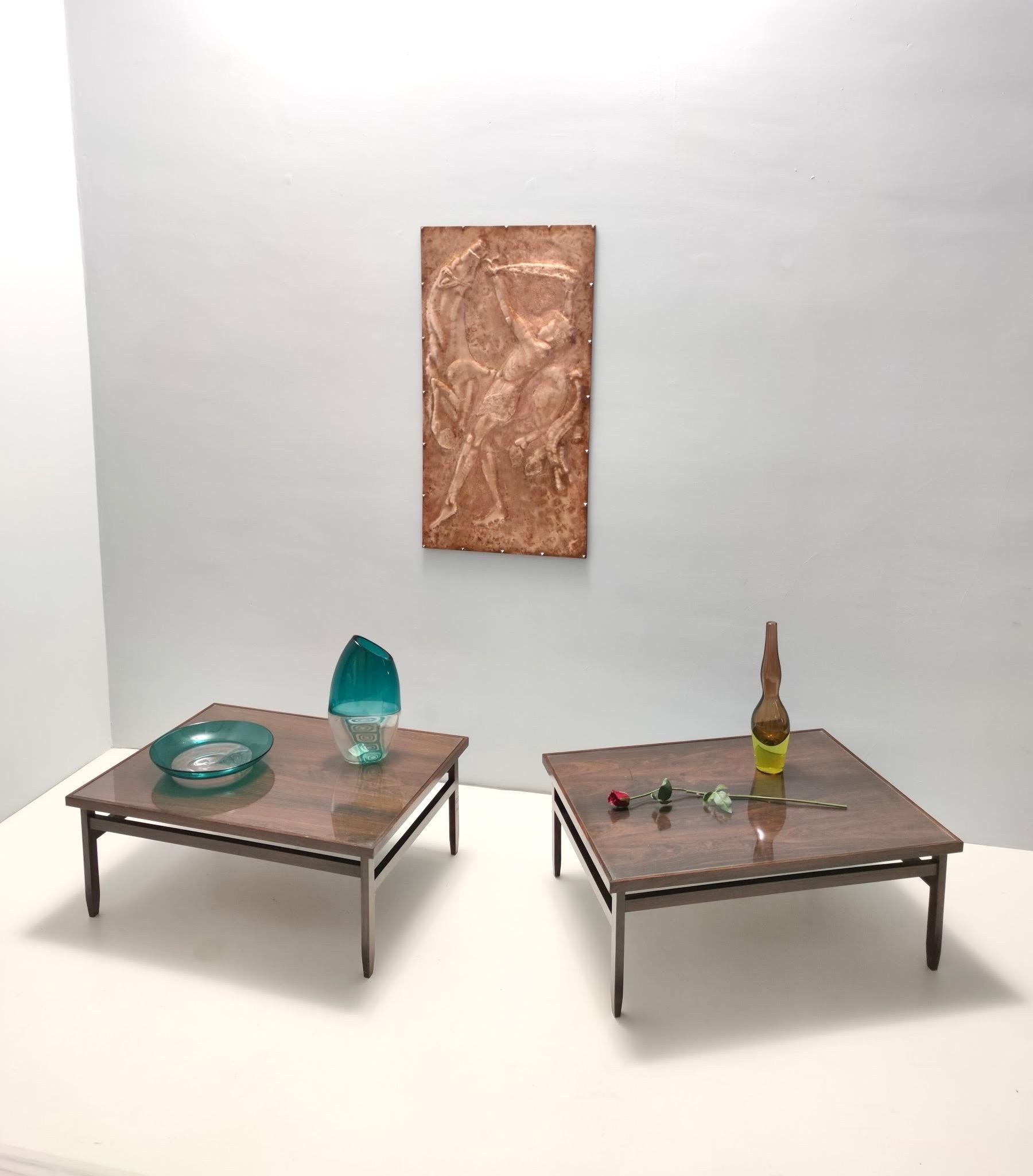 Made in Italy, 1950s.
These rectangular coffee tables are made in ebonized walnut and glass. 
They are both quite solid and sturdy.
They are vintage, therefore they might show slight traces of use, but they can be considered as in excellent original