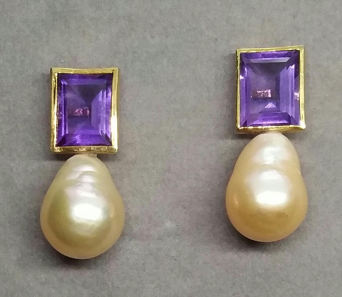 These simple but elegant Handmade Earrings have 2 faceted rectangular and perfectly clean Natural Amethysts measuring 9x11 mm and weighing 6 carats set in yellow gold bezel at the top to which are suspended 2  Natural Cream Color Pear Shape Baroque