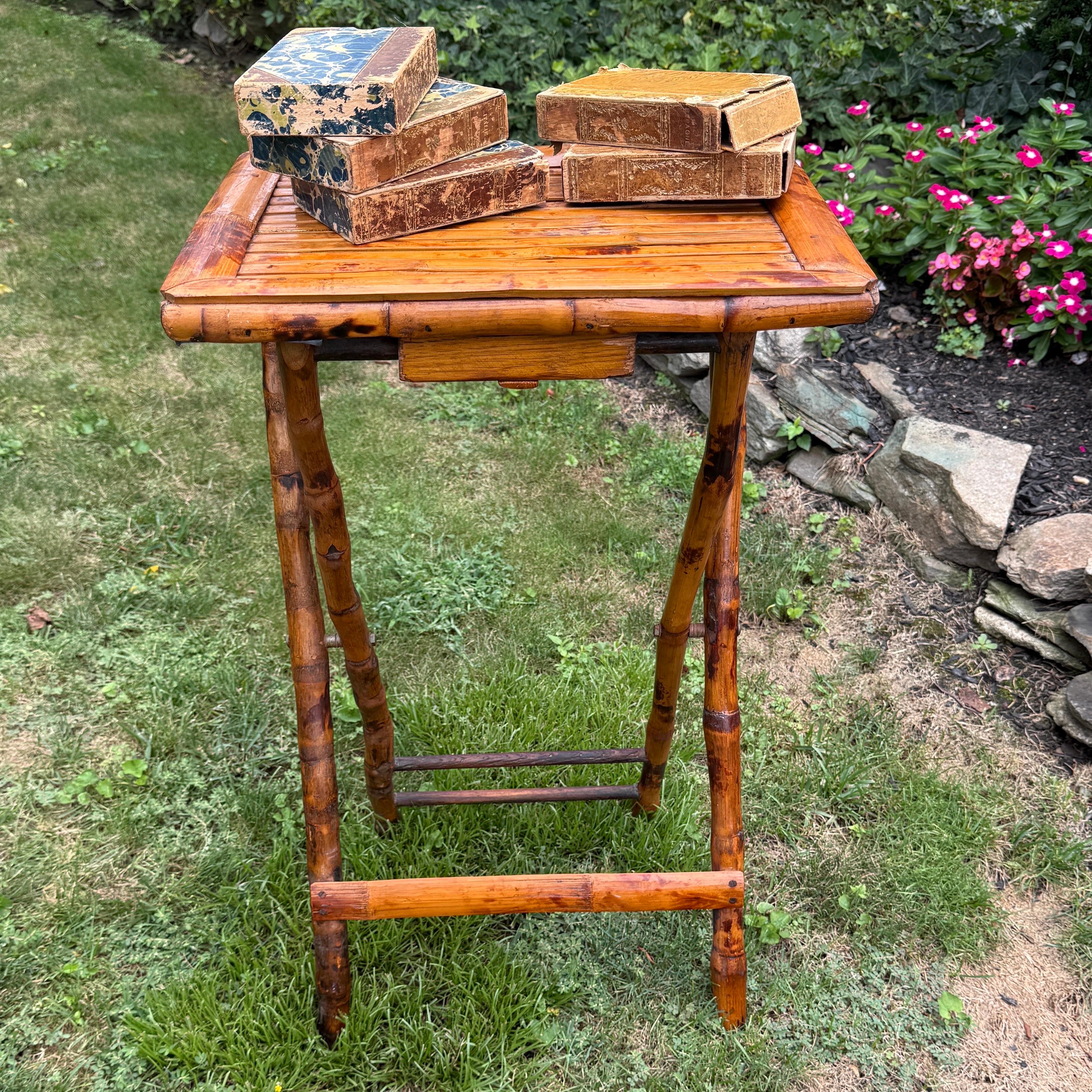 Classic wood bamboo side table or butler’s table. We see this collapsable small bamboo table used as a bar to hold wine or liquor bottles in a living room, dining room or patio. Also could be used as a side table in a bedroom. A lovely vintage piece