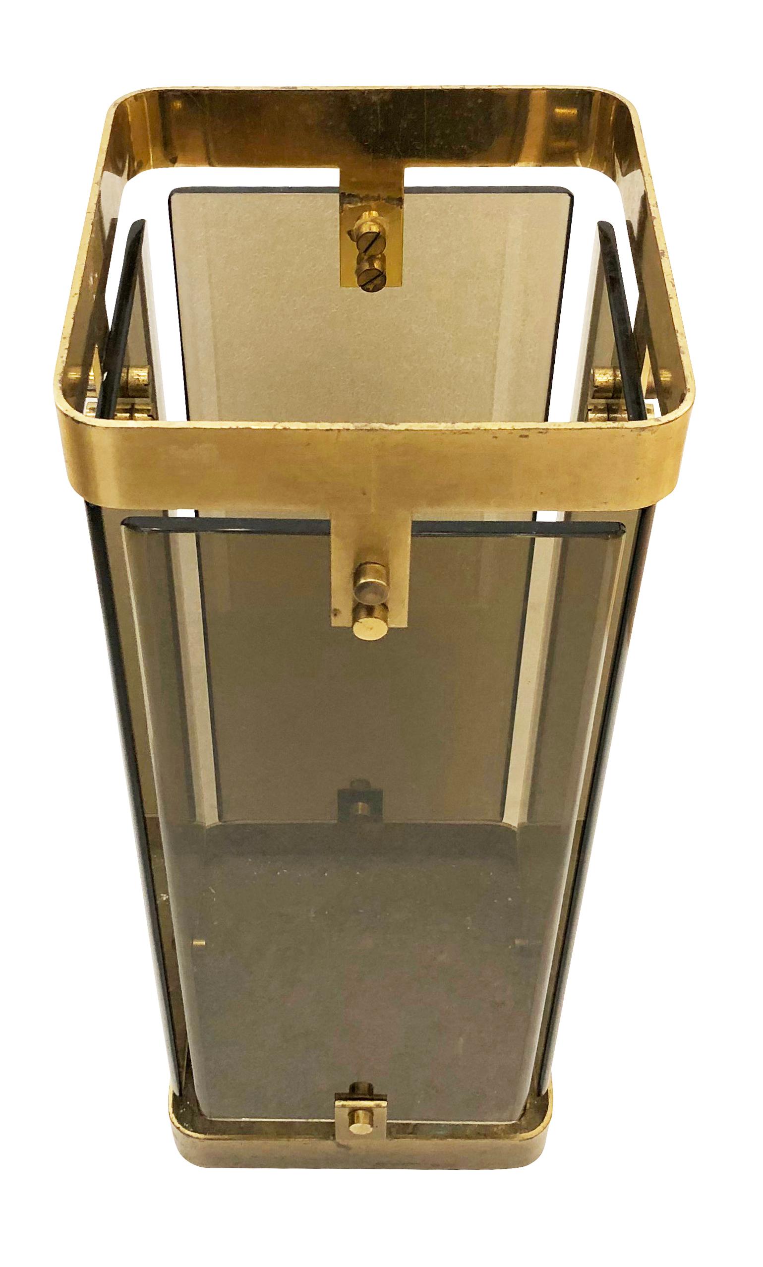 Fontana Arte umbrella stand with brass framing and four rectangular smoked glasses.

Condition: Good vintage condition, minor wear consistent with age and use. Brass can be polished upon request.

Measures: Width 9”

Depth 9”

Height