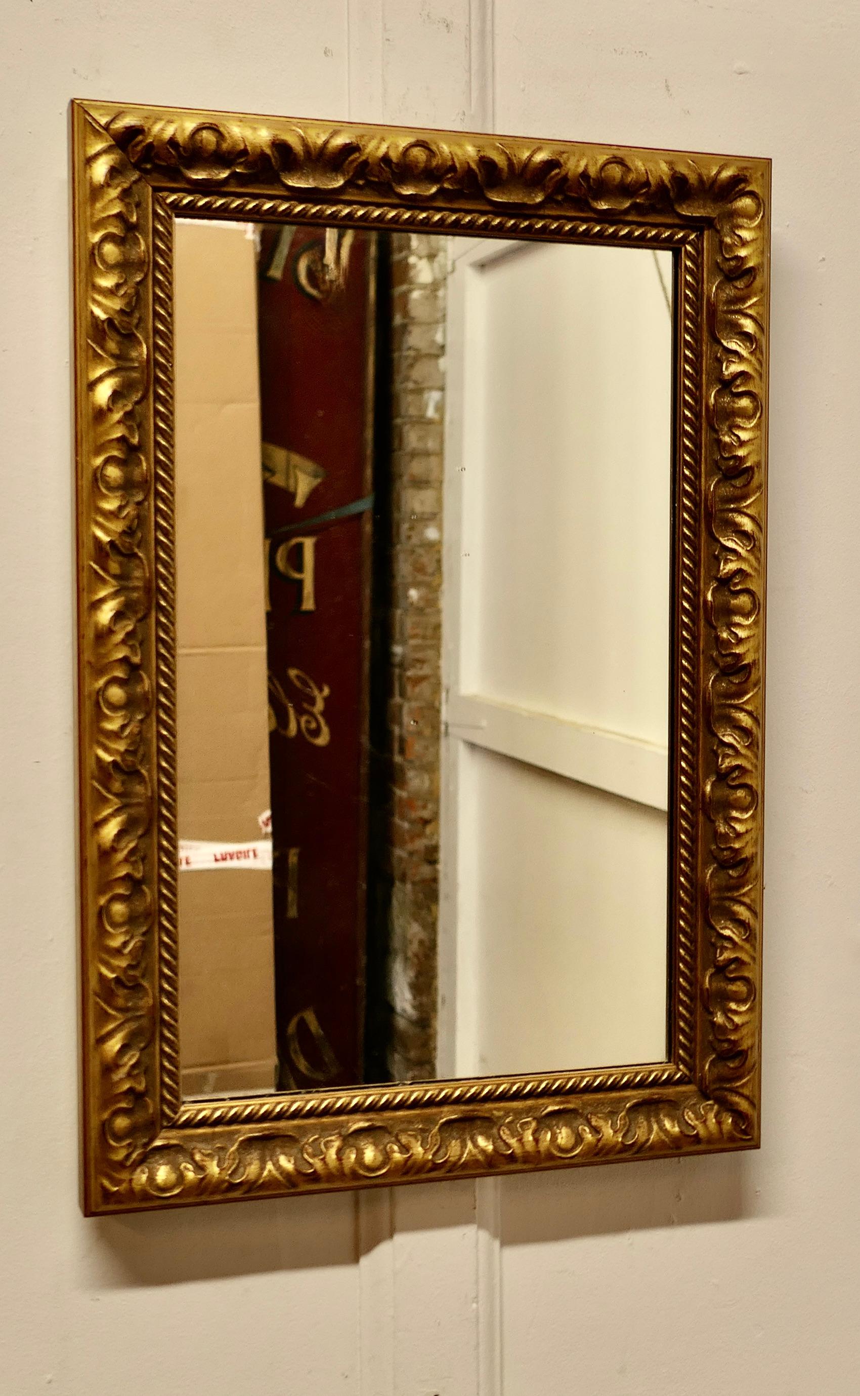 Rectangular Gilt Wall Mirror

The mirror is in a 2” wide decorated Gilt Frame, this can be hung Both Landscape and Portrait it is a good size and a very attractive piece
The glass and the frame are in good antique condition  
The overall size  is