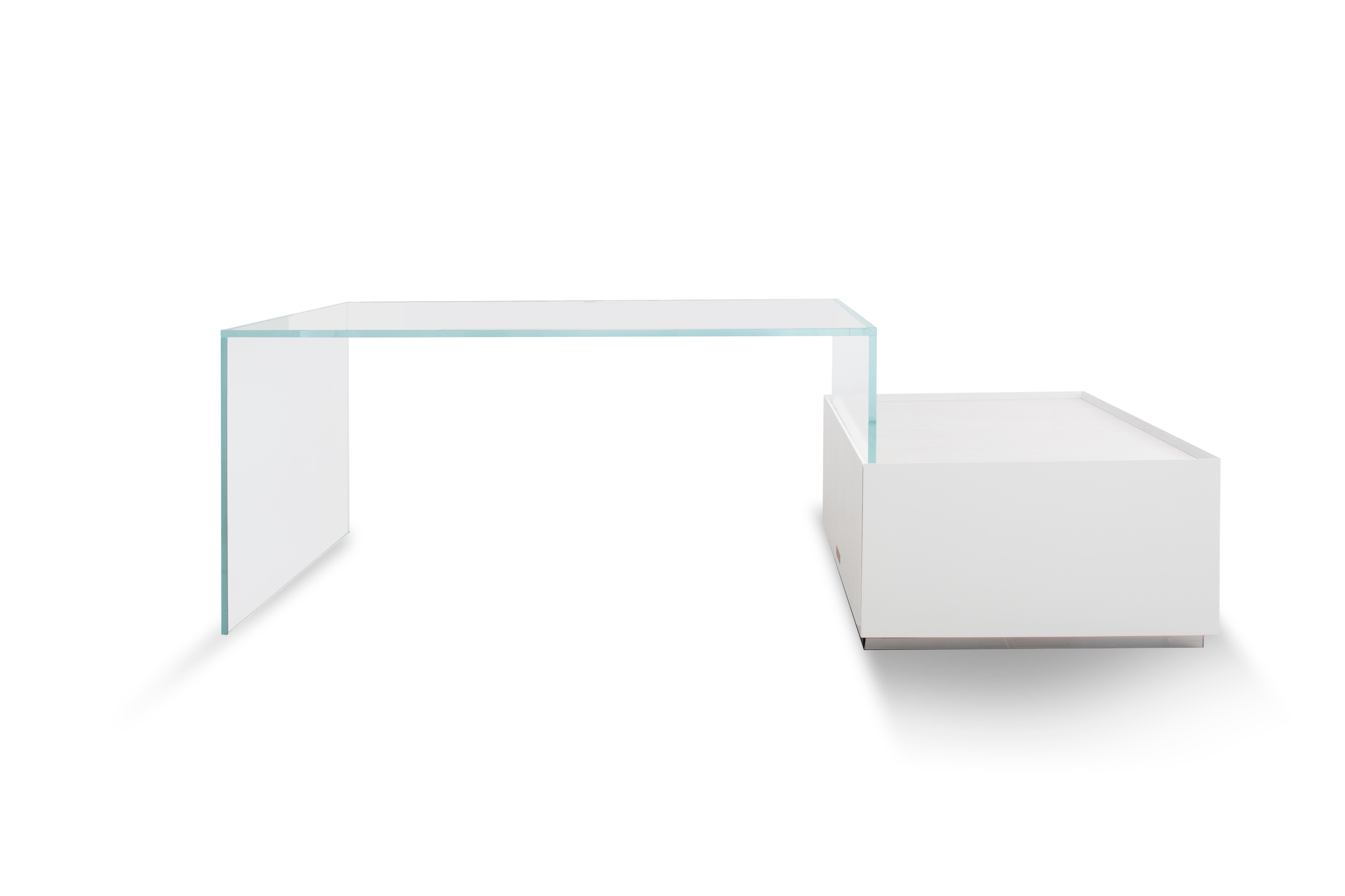 Sky Bridge is a glass desk with a pure multifunctional storage unit in white oak for the contemporary digital nomad – clean, light and functional.
 
As shown wood: White milk oak glass: Clear glass.

Handcrafted in Italy.