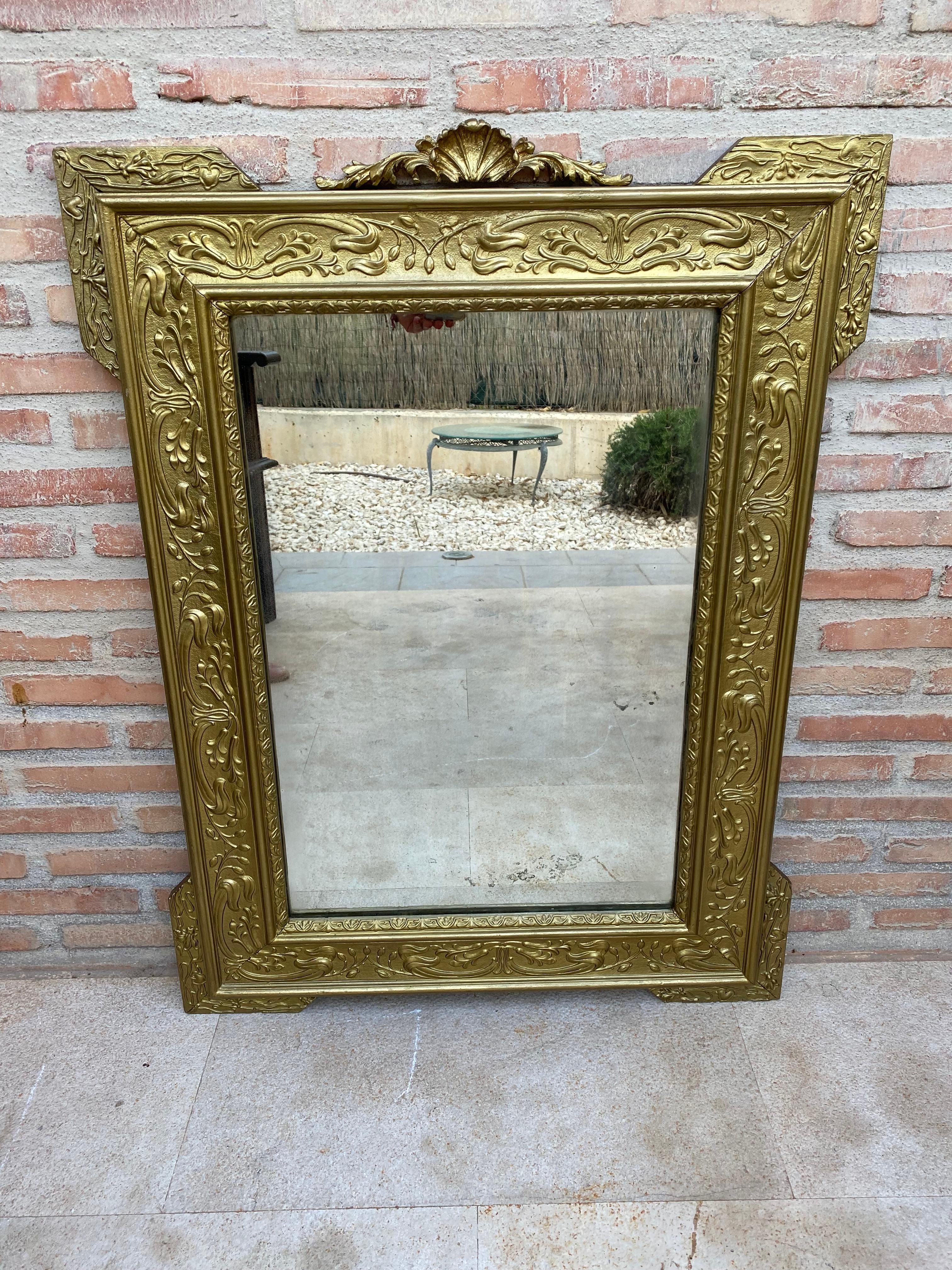 Spanish Colonial style handcrafted mirror. Rectangular hand carved wooden structure with gold foiled finish, Spain, 1960.

Design Period	1960 to 1969
Year	1960
Production Period	1960 to 1969
Country of Manufacture	Spain
Style	Spanish