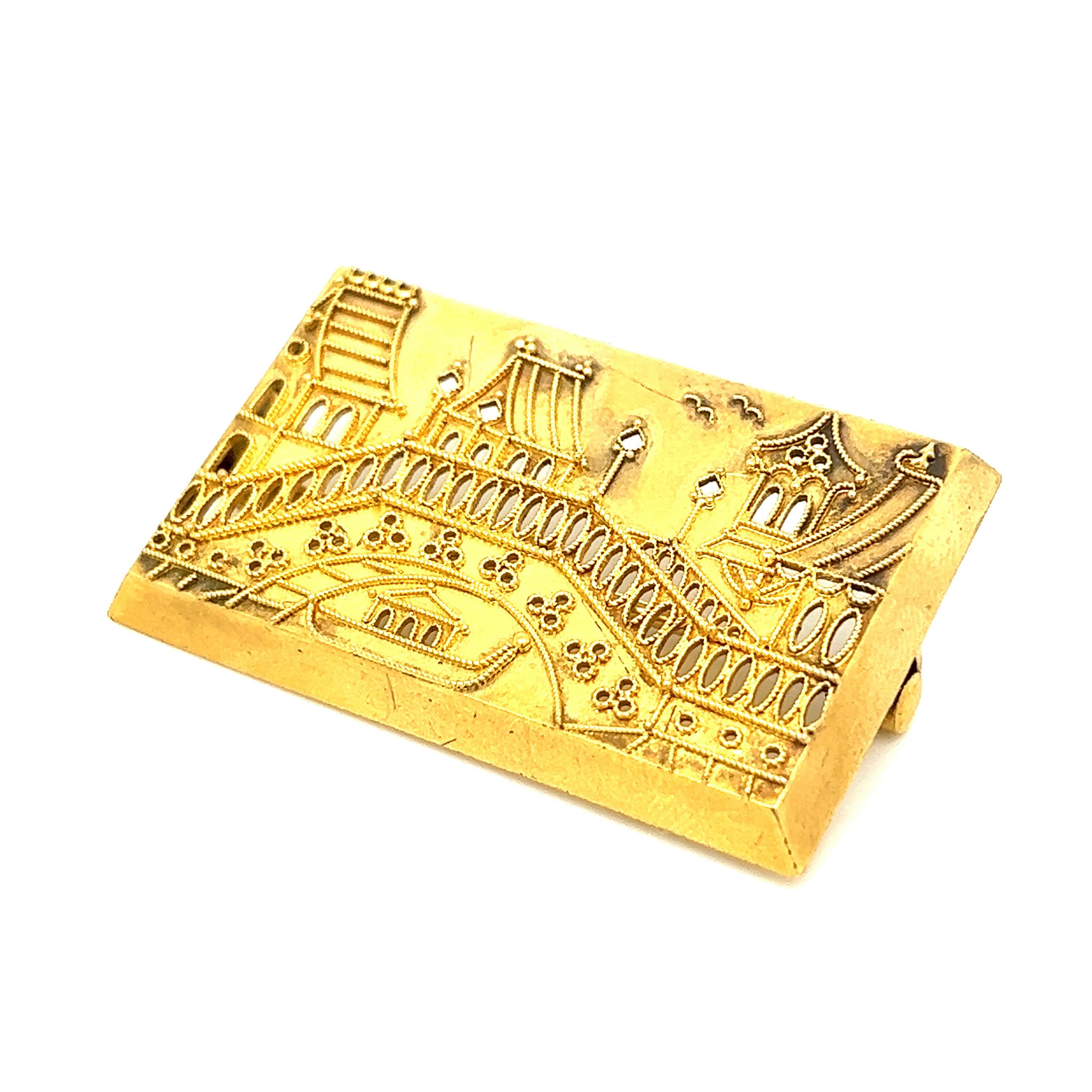 Rectangular gold scenic brooch

Features a scenic view of a town; 14 karat yellow gold 

Size: width 1.75 inches, length 1.13 inches
Total weight: 9.6 grams
