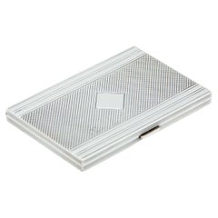 Rectangular guilloche silver case with diamond relief and monogram