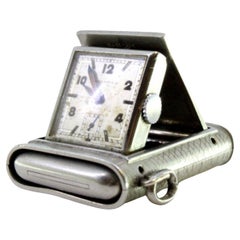 Rectangular hand-wound pocket/travel watch with a side-press opening lid