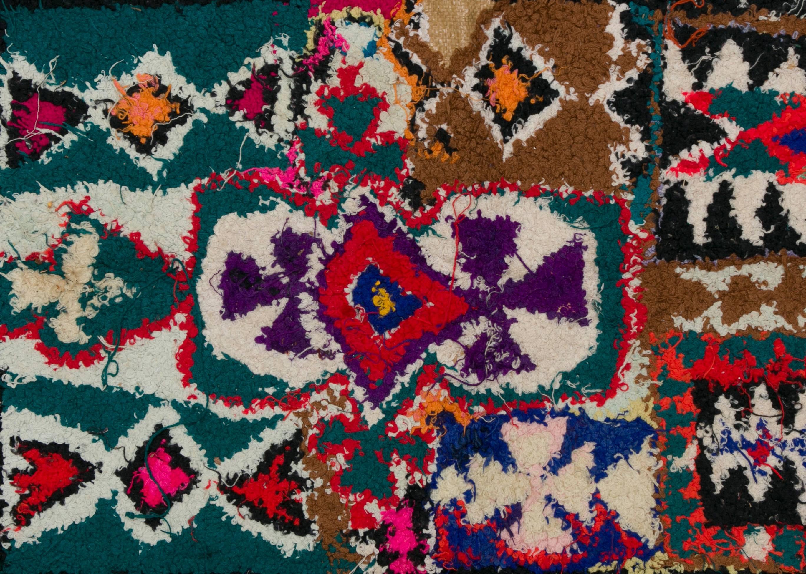 Zindekh tapestry made by Berber women from the Atlas Mountains.
Made from woolen ends and other threads, embroidered on wasted plastic bags of cereals, this unique and vintage work is the demonstration of the Secret transmitted from mother to