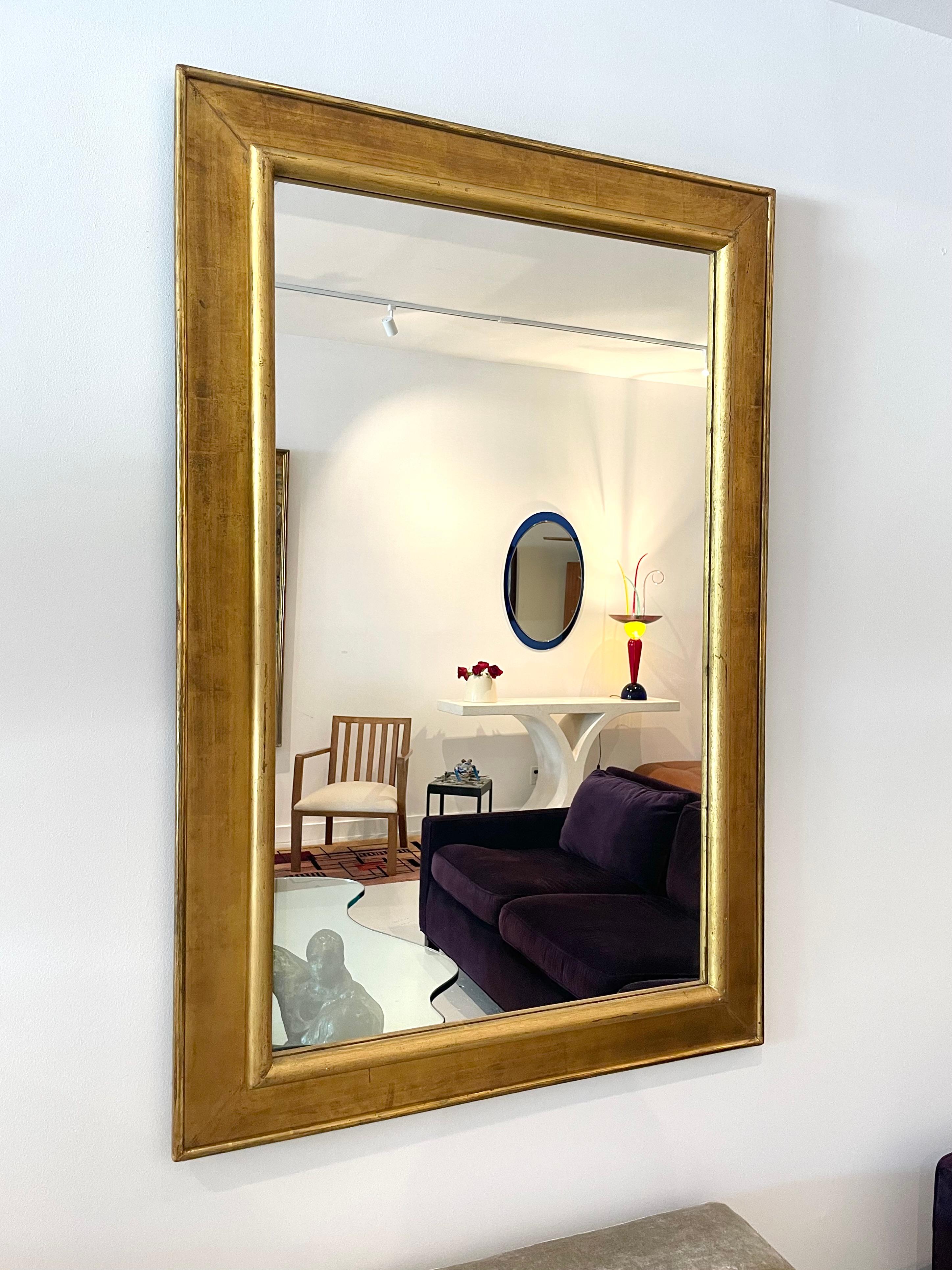 Classic and modern Italian gilt wood, rectangular mirror that is ready for both vertical and horizontal hanging. Weighs approximately 30 pounds. 