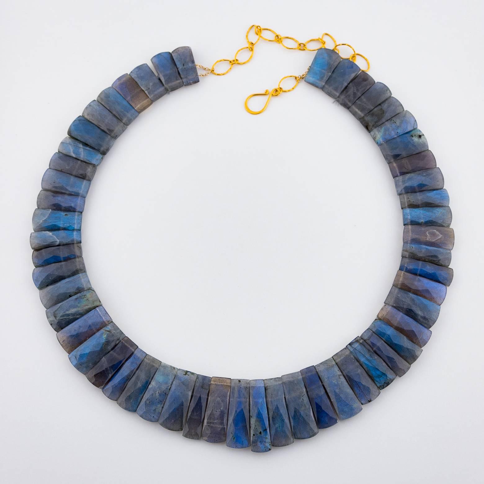 This beautiful Labradorite necklace is stunning and has a great weight to it. The iridescence of it captures the light is so many different angles that the blue tones absolutely glow! Very regal and very elegant!