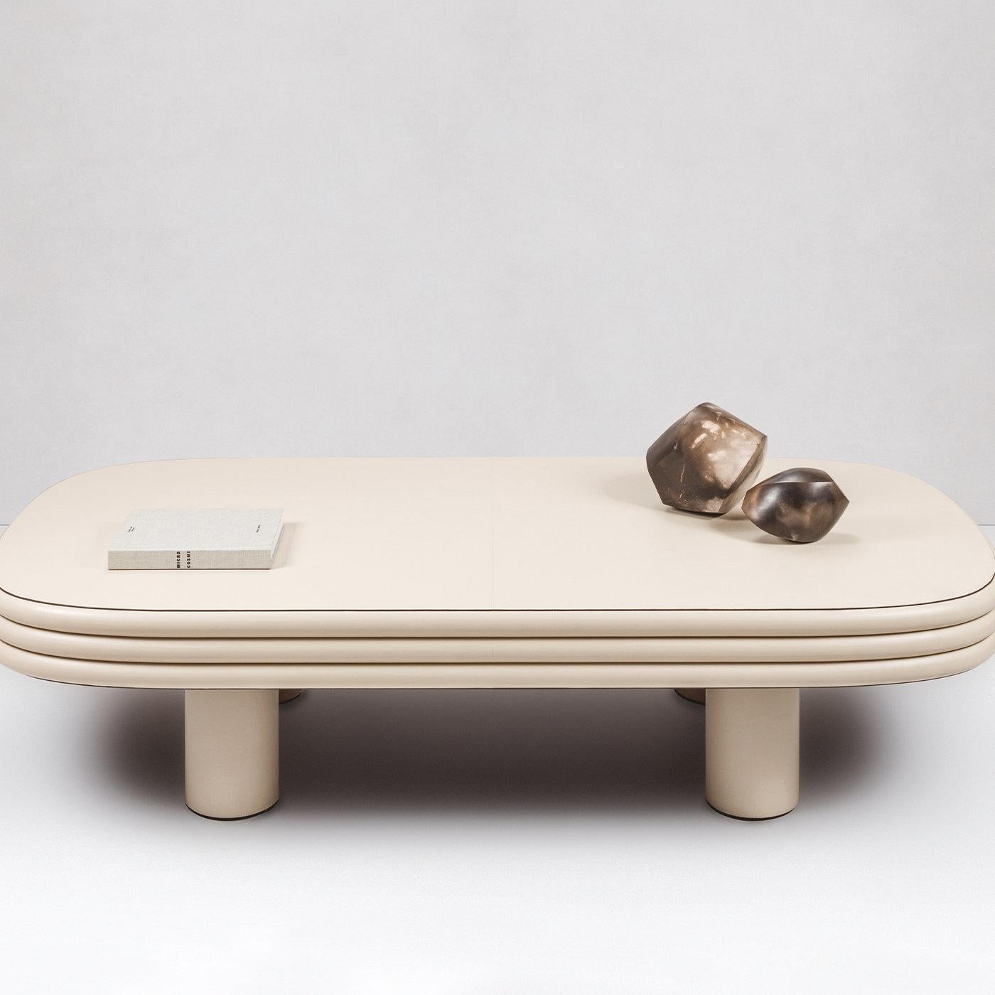 Contemporary leather rectangular coffee table - Scala by Stephane Parmentier for Giobagnara.
The object presented in the image has following finish: F06 Ivory Nappa Leather.

Characterized by a dynamic interplay of shapes, this coffee table