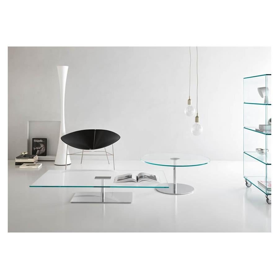 Tempered glass coffee table with chromed metal base.
Flashes of light and three-dimensional effects, thanks to the mirrored chrome finish of the base and support.
Giovanni Tommaso Garattoni

Made in Italy:
Made in Italy furniture means design,