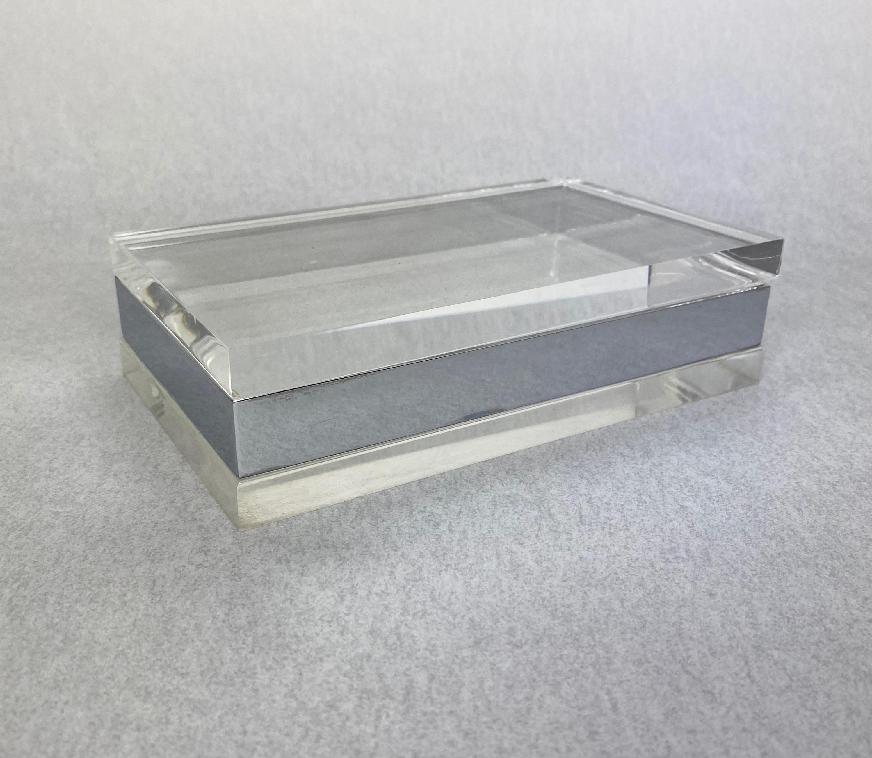 Rectangular box made in Lucite and with chrome details.
 