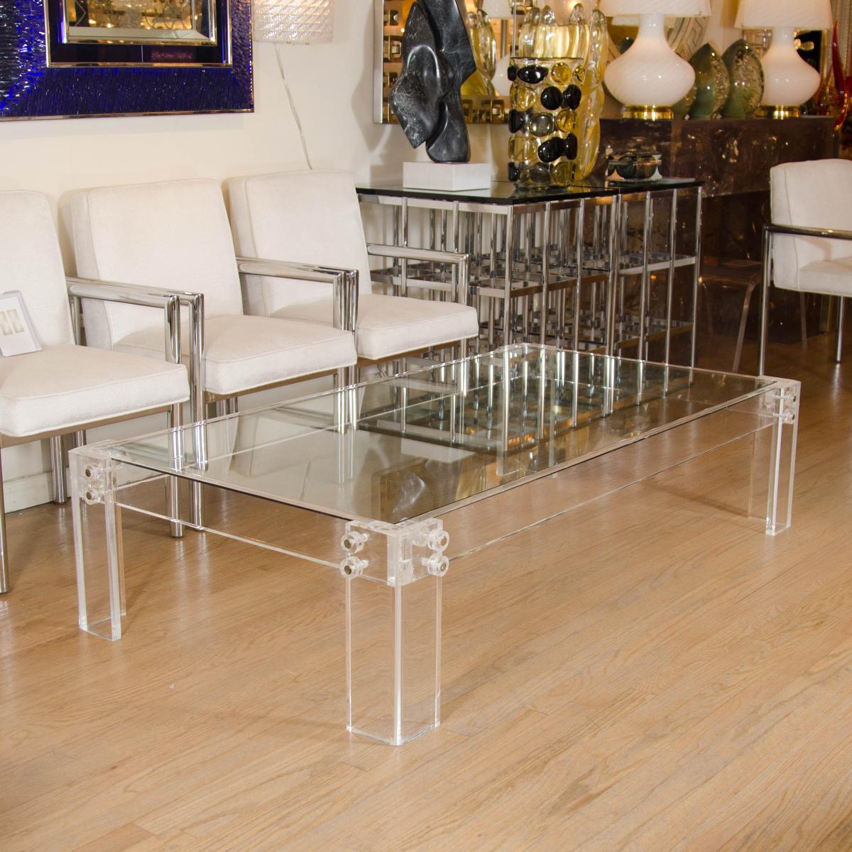 Rectangular lucite coffee table with glass top and nickel detail.