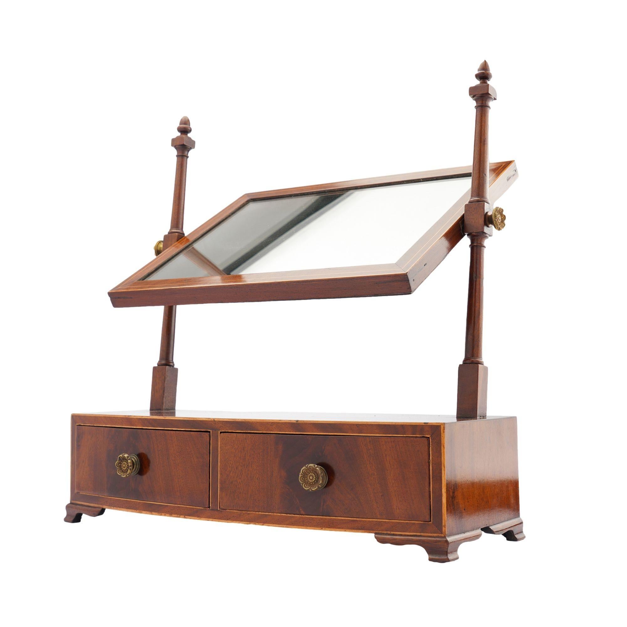 American Rectangular mahogany swinger dressing mirror on a bow front stand, 1790 For Sale