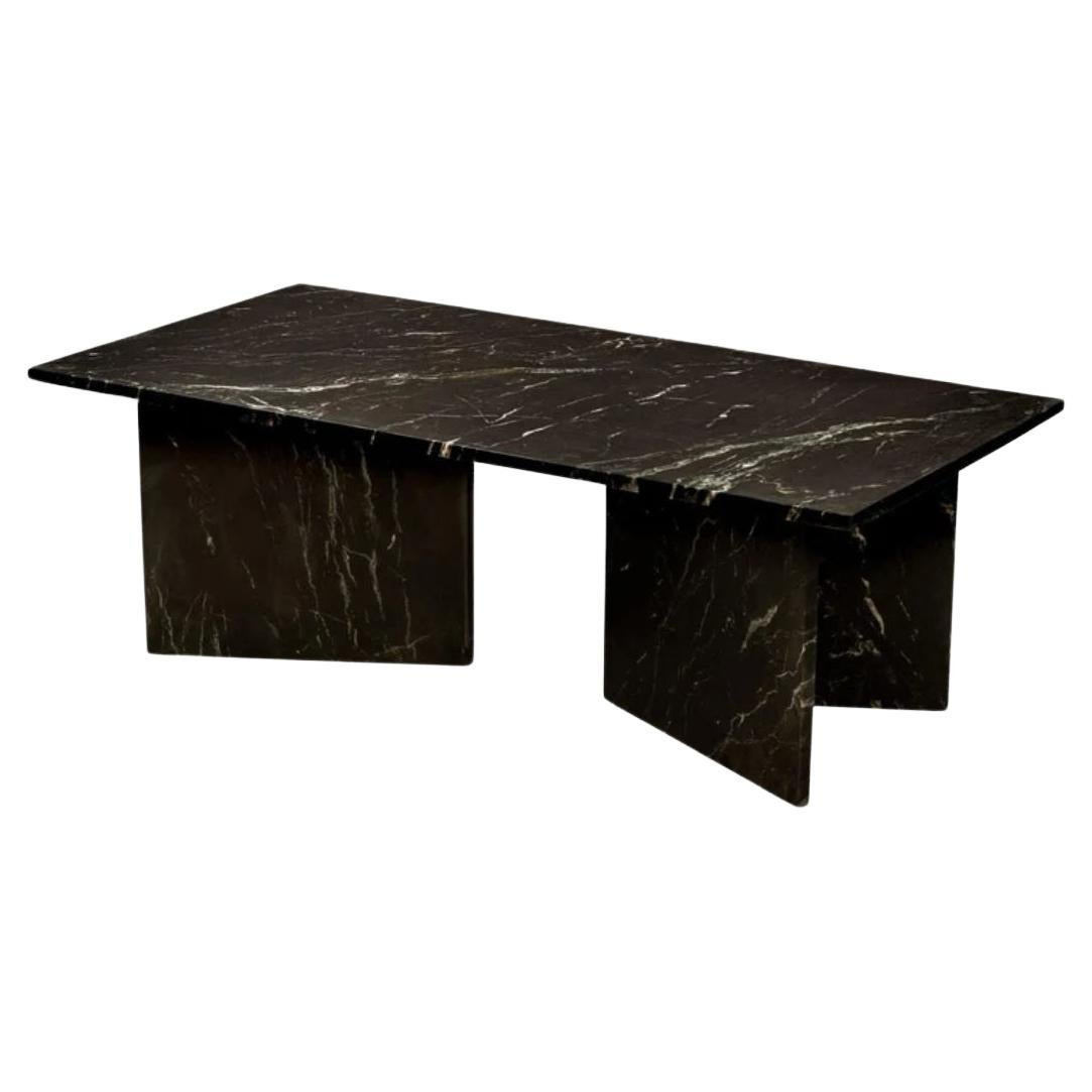 Allow us to introduce the Rectangular Marble Coffee Table, a true embodiment of contemporary design that offers a spectrum of luxurious marble choices. This table is a testament to opulence, radiating a sense of grandeur while embodying a sculptural