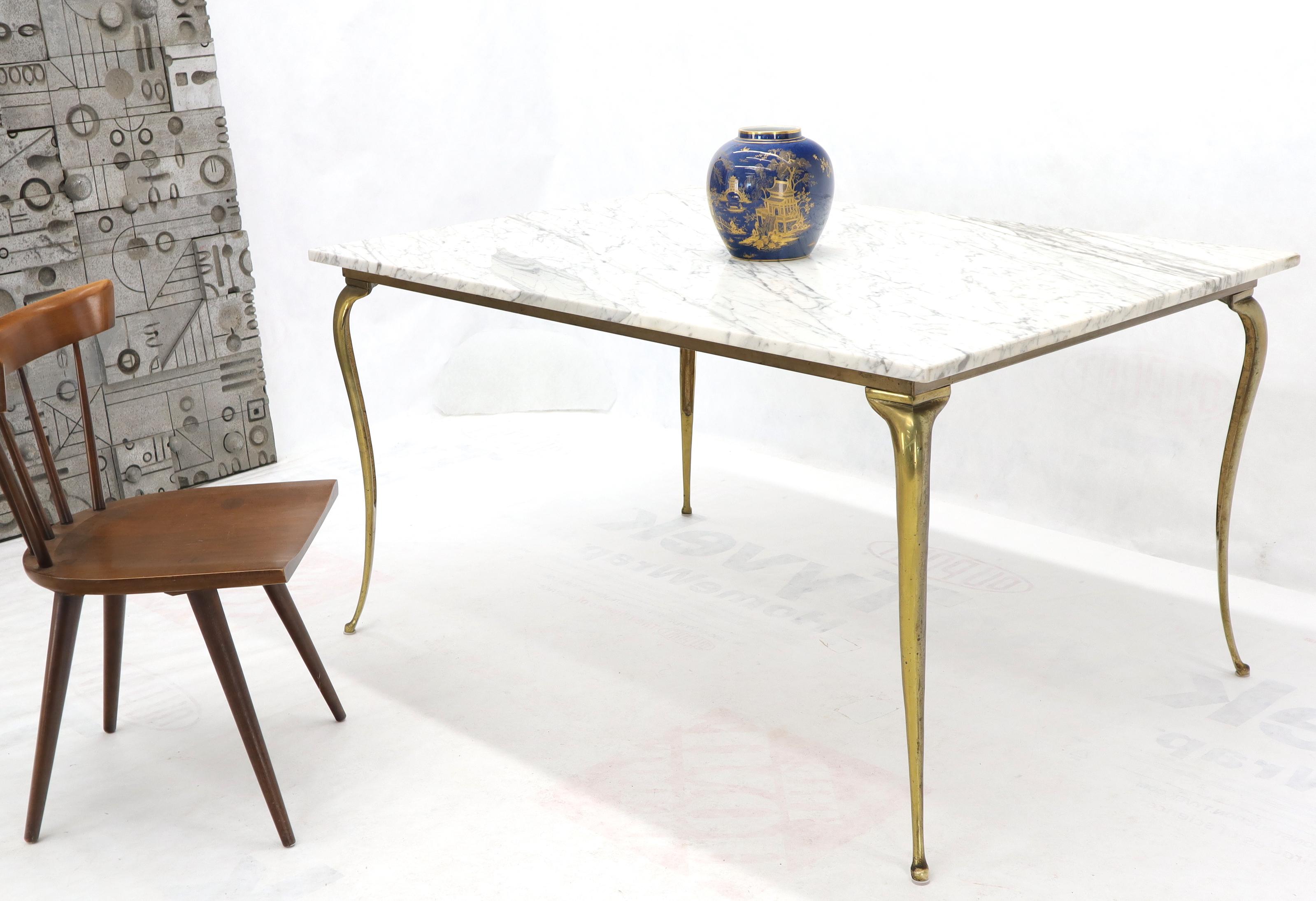 Designers possibly Italian midcentury Art Deco era marble top dining table on brass legs.