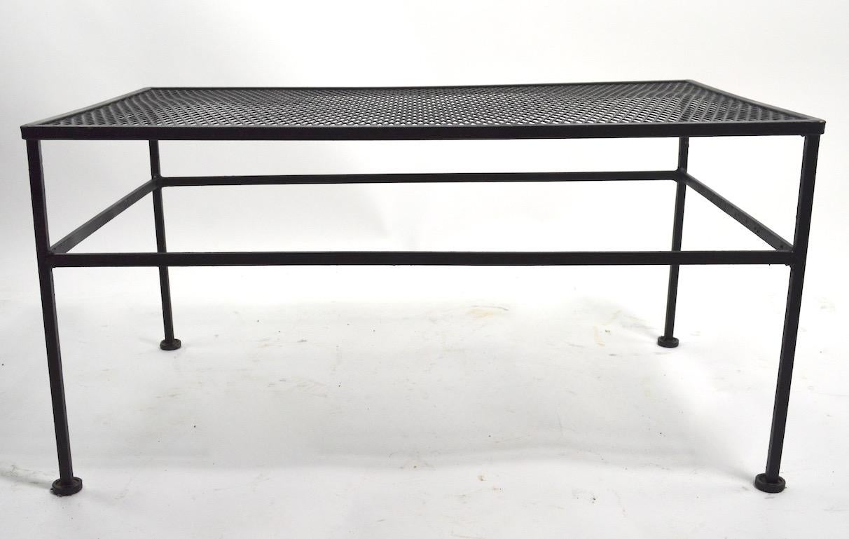 Rectangular metal mesh table suitable for indoor, and outdoor use. Currently in later black paint finish. No structural damage or repairs, suitable for indoor or outdoor use.