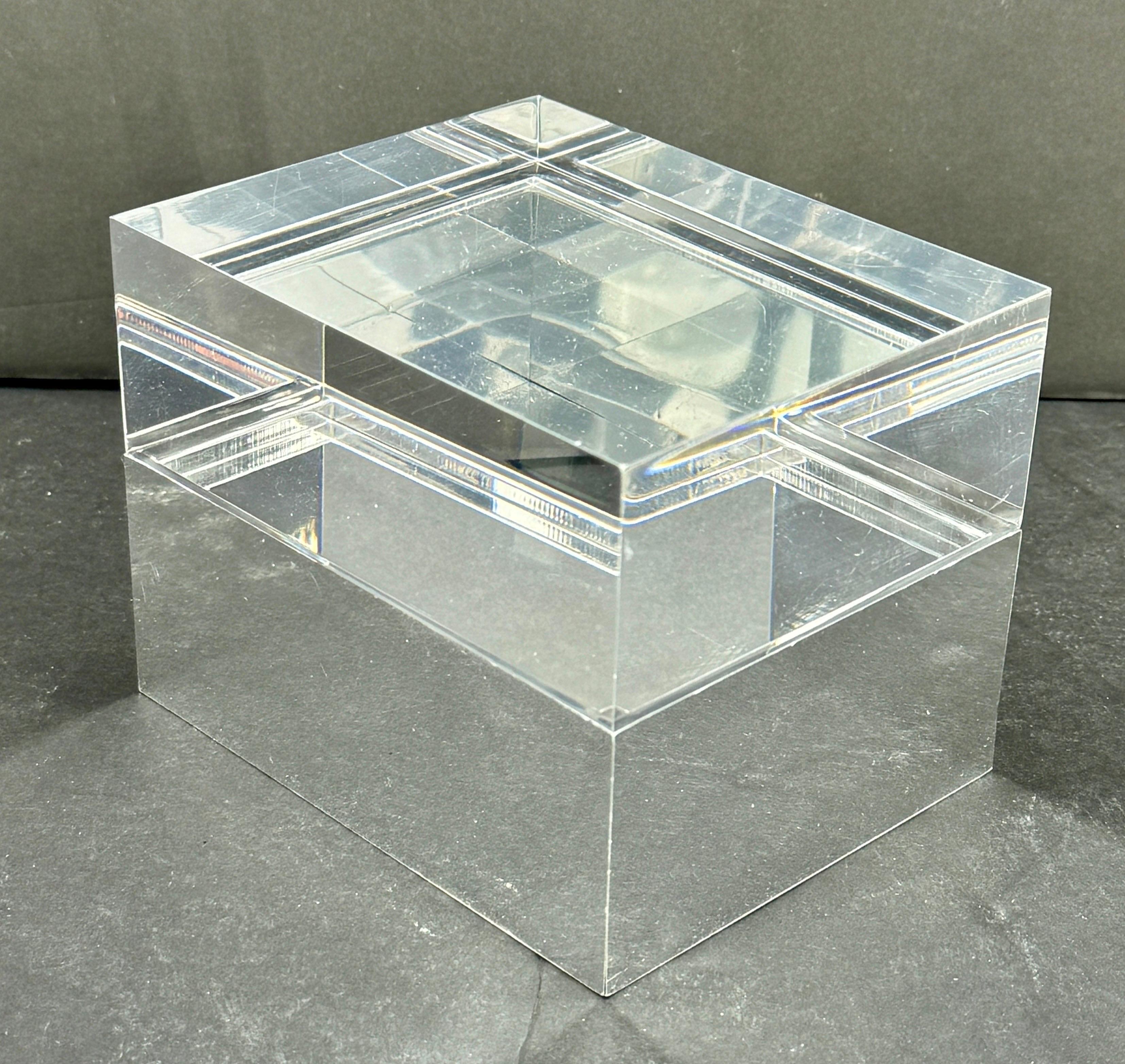 Thick Lucite and Chromed Jewelry Box by Alessandro Albrizzi, MCM
A vintage lucite lidded box, the top being clear, the bottom being chromed. The box was designed by Alessandro Albrizzi in the 1970's. This box is very versatile and could be used on a