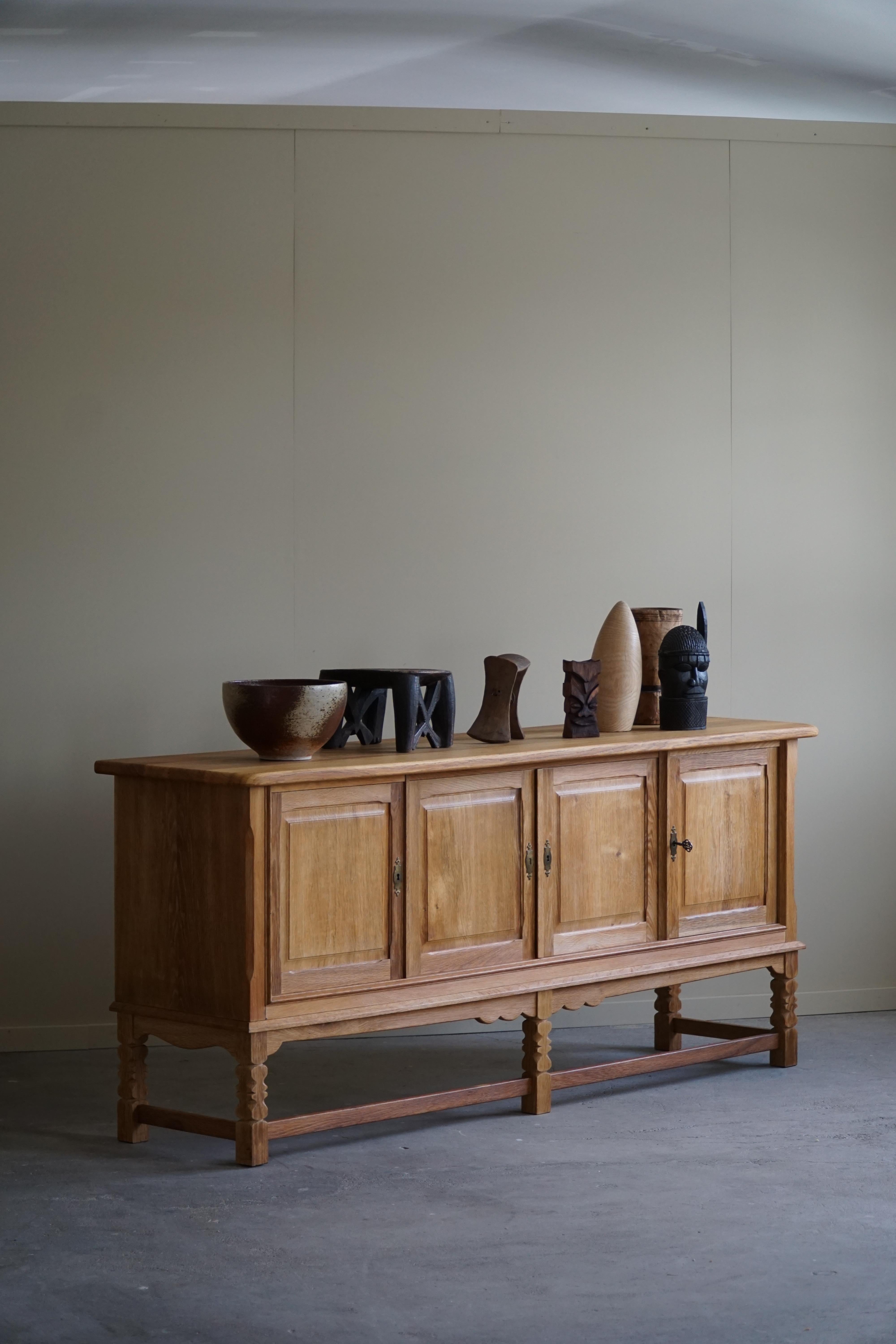 Introducing a timeless sideboard crafted by a Danish cabinetmaker in the mid-century era of the 1960s. This elegant and functional piece embodies the Scandinavian design principles of simplicity, functionality, and natural materials, making it an