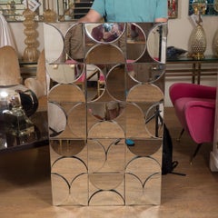 Rectangular mirror with allover demilune mirror mosaic.