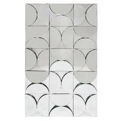 Rectangular mirror with allover demilune mirror mosaic.
