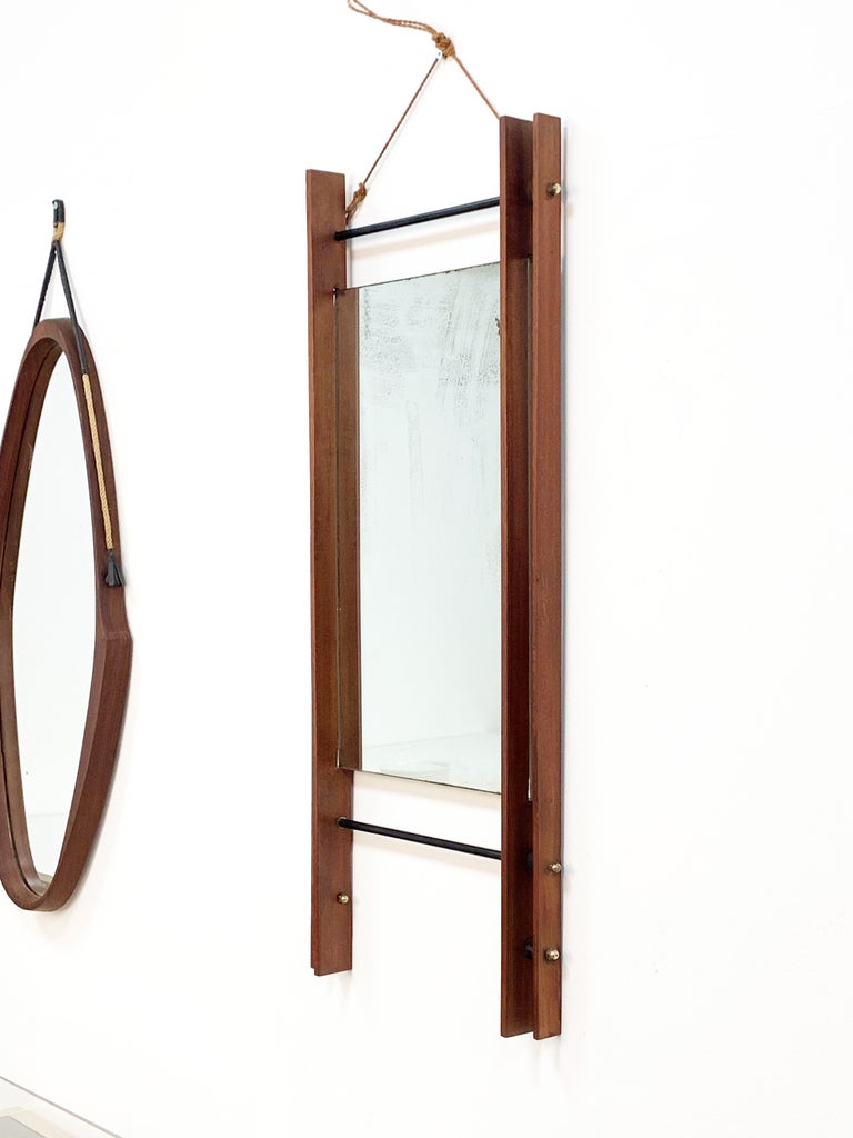Rectangular mirror with double teak frame, wall mirror. Italy, 1950s.
Measurements: 40 x 90 x 5.5 cm.

Vintage, signs of use of time.
