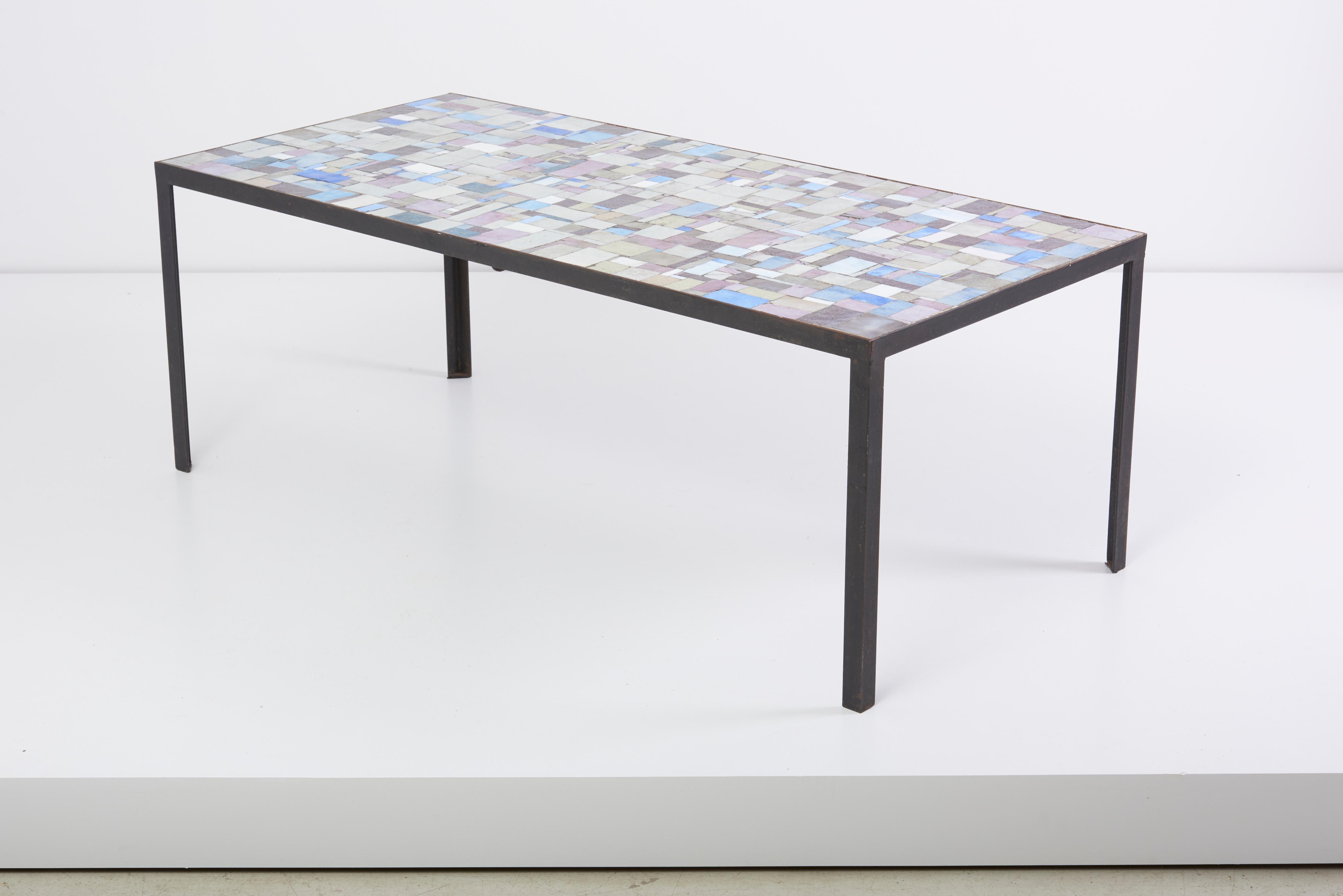 Rectangular coffee table with beautiful mosaic top.
Underneath signed with 