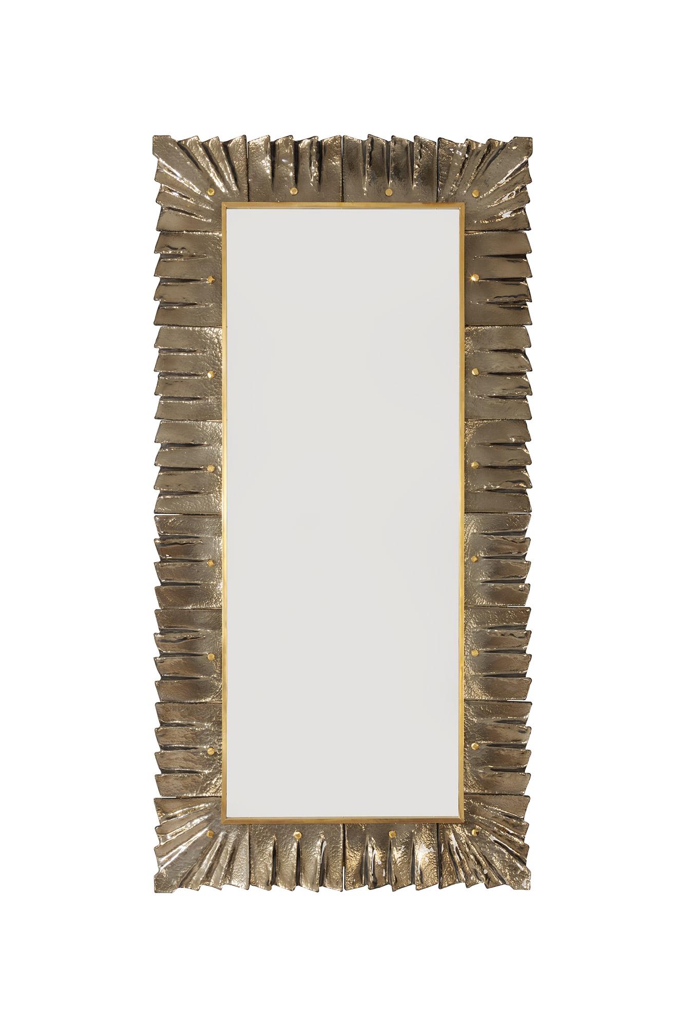 Large Rectangular amber/bronze Murano glass framed mirror, in stock 
Contemporary and customizable mirror plate surrounded with undulating glass tiles amber bronze color held by brass cabochons.
Brass gallery and solid brass cabochon accents. 
Glass