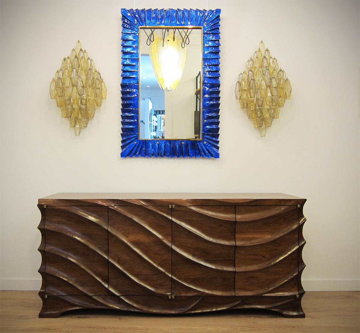 Rectangular Murano Cobalt Blue Glass Framed Mirror
Mirror plate surrounded with undulating glass tiles in cobalt blue color held by brass cabochons. 
Handcrafted by a team of artisans in Venice, Italy. 
Can be easily hung vertically or horizontally