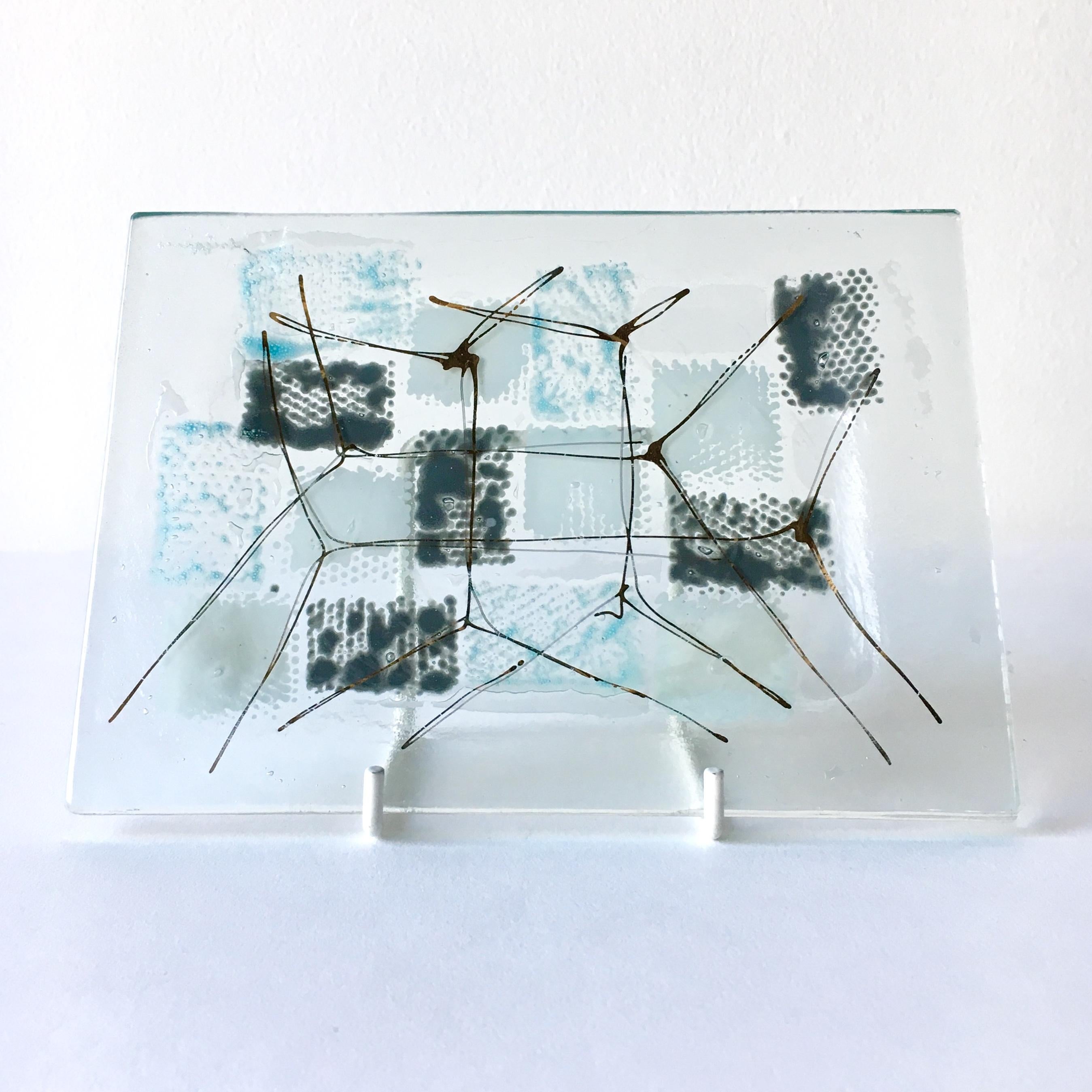 A rectangular patchwork fused glass plate by Michael and Frances Higgins, USA, 1957-1965

Michael Higgins (1908-1999) and Frances Higgins(1912-2004) met in Chicago and were married in 1948. They had a fascination of modern glass fusing. Their