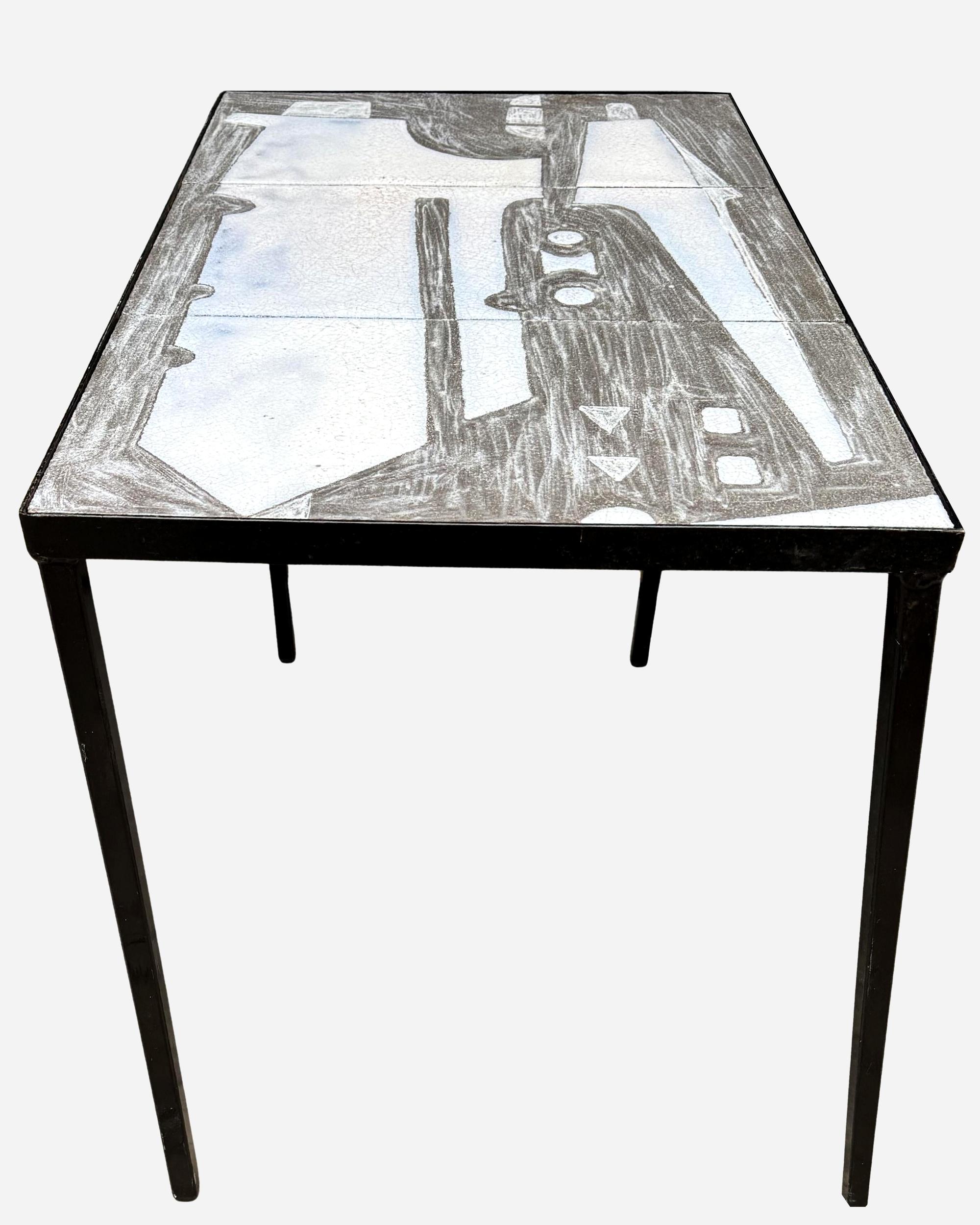 Rectangular pedestal table with glazed terracotta top: three raised glazed terracotta tiles, featuring an abstract design. 

Thick bluish-white enamel in relief and grey charcoal-style enamel in recess.

Length: 76 cm (30 inches)
Width: 46 cm (18.11