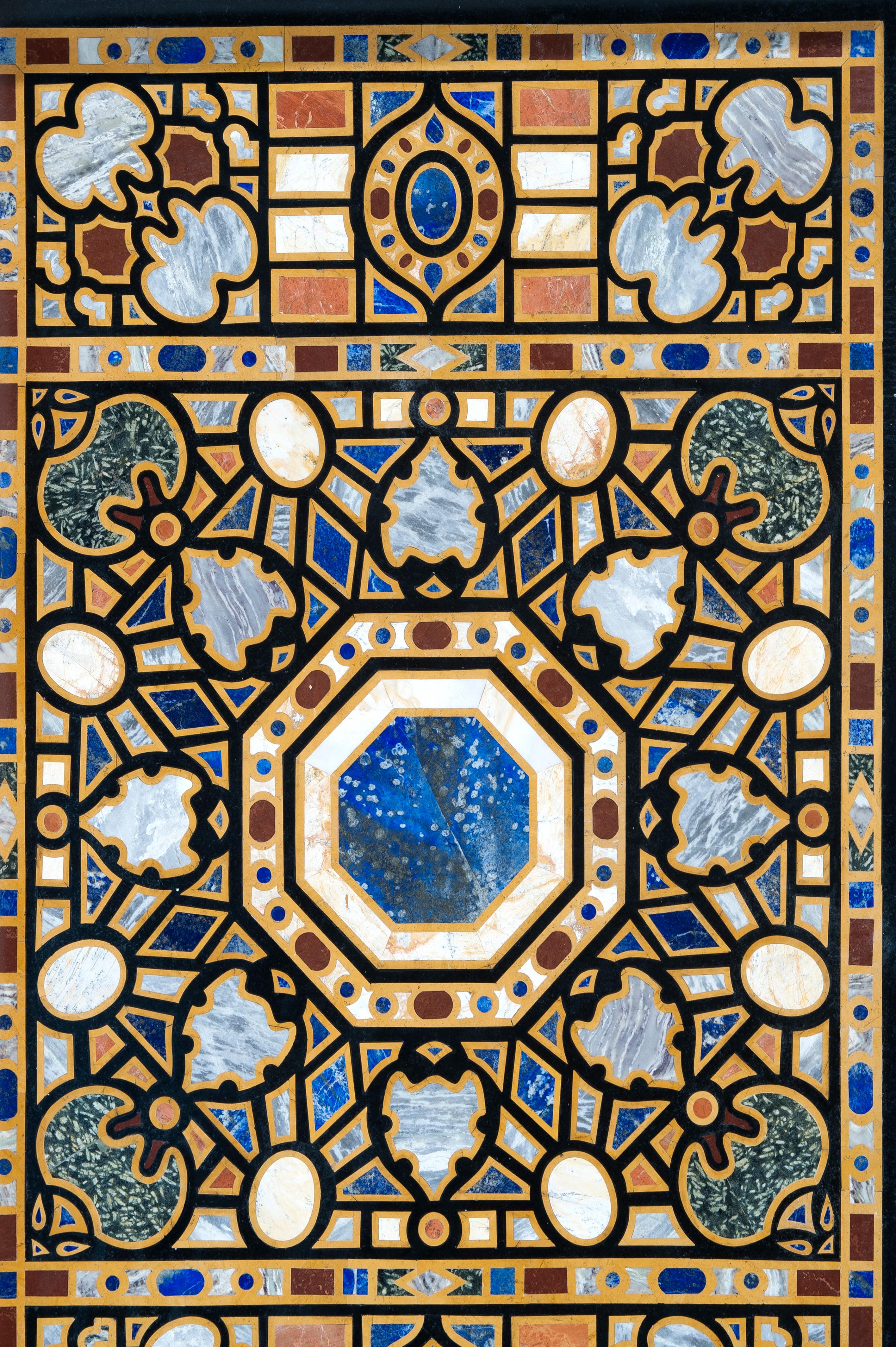 Rectangular board of marbles and hard stones. Inspired by Italian models of the XVI-XVII centuries. Rectangular table top with geometric decoration organized symmetrically around an octagon of lapis lazuli framed in a star with teardrop-shaped