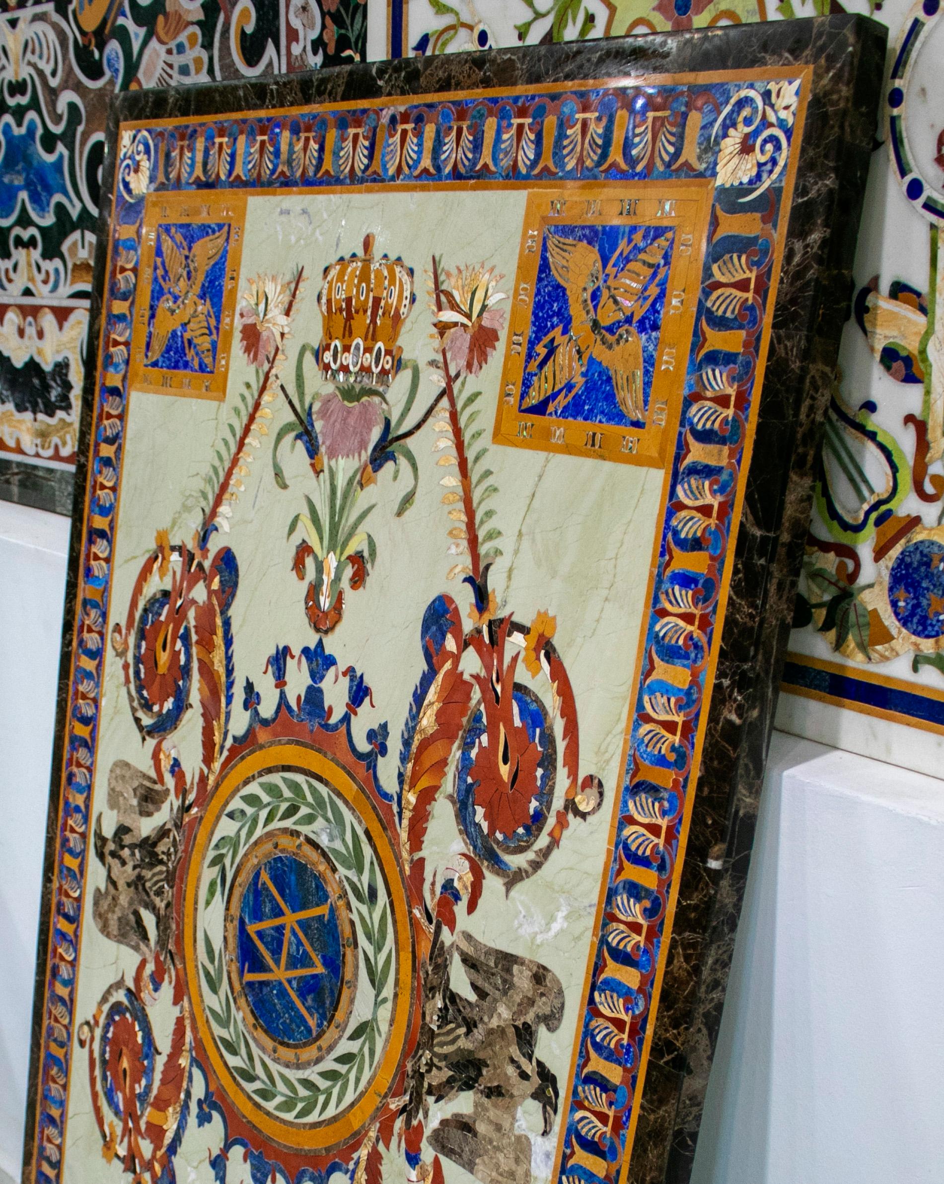 Rectangular Crema Marfil marble table top profusely decorated with Italian Pietre Dure mosaic inlays drawing crowns eagles and ornamental decorations using blue lapis lazuli, semiprecious stones and marbles

