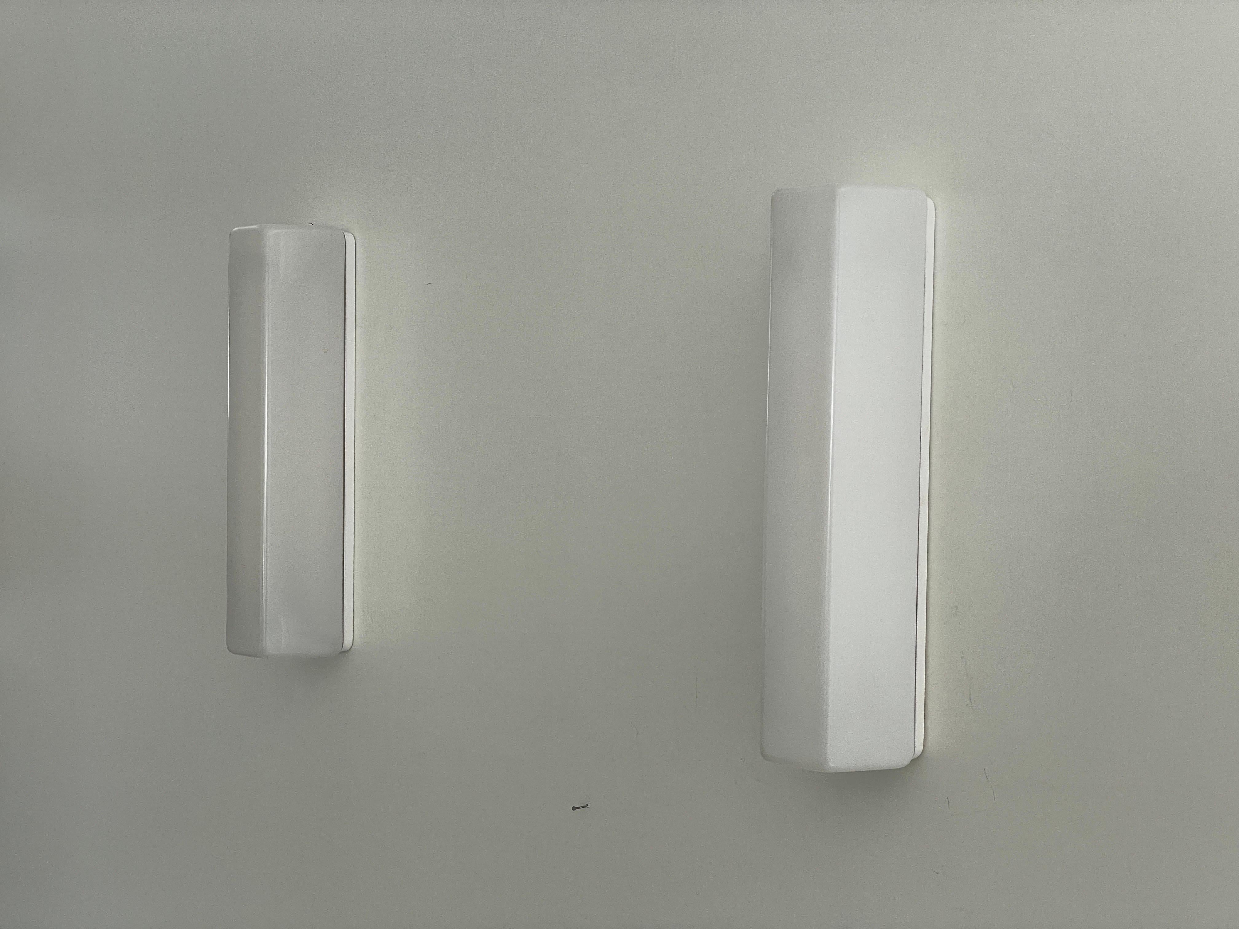 Rectangular Prism Plexi Pair of Sconces with Fluorescent Tube, 1960s, Germany

Very elegant and minimal design wall lamps
Lamp is in very good condition.

Note: 16 pair available.

These lamps works with Fluorescent Tube. 
Wired and suitable to use