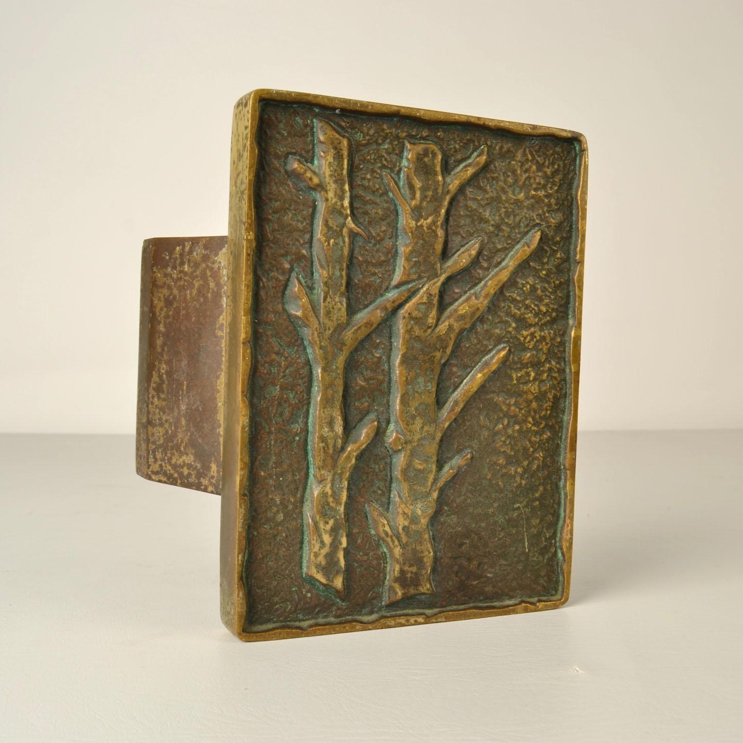 Single rectangular door handle with trees in relief. Cast bronze relief in perfect condition. The bronze has a strong patina due to the textured surface and its age, circa 1970's. This can be polished to bring out the sheen of the bronze.
Artistic