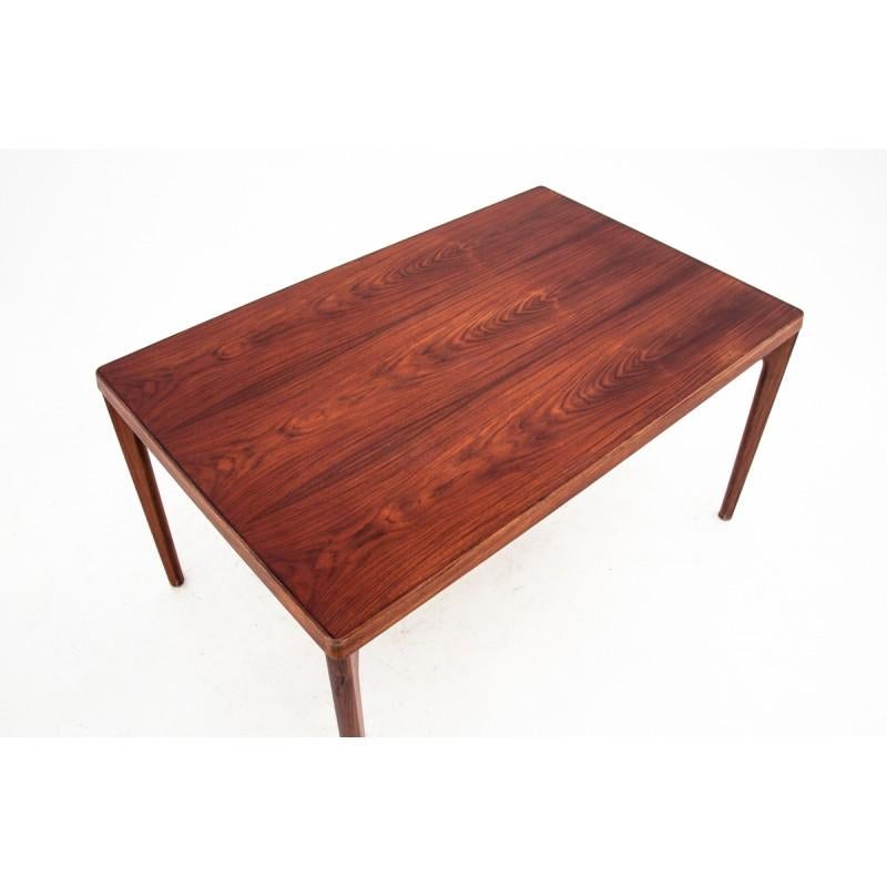 Rosewood rectangular table comes from Denmark in the 1960s. In excellent condition, after the wood renovation process. It has one additional inserts that allow it to unfold up to 220 cm.
