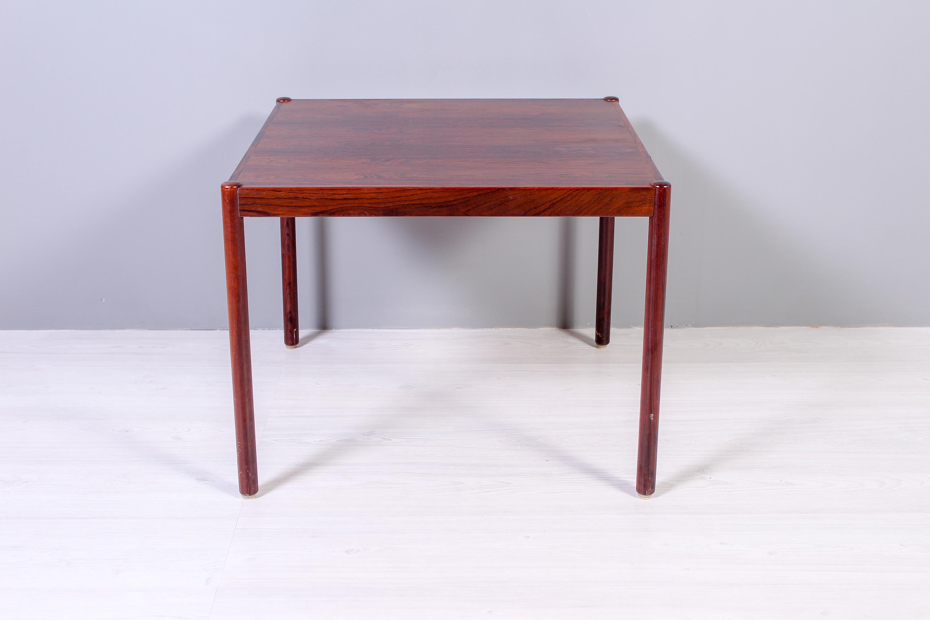 A minimalistic rosewood coffee table made in Scandinavia during the 1950s. Very good vintage condition with minor signs of usage.