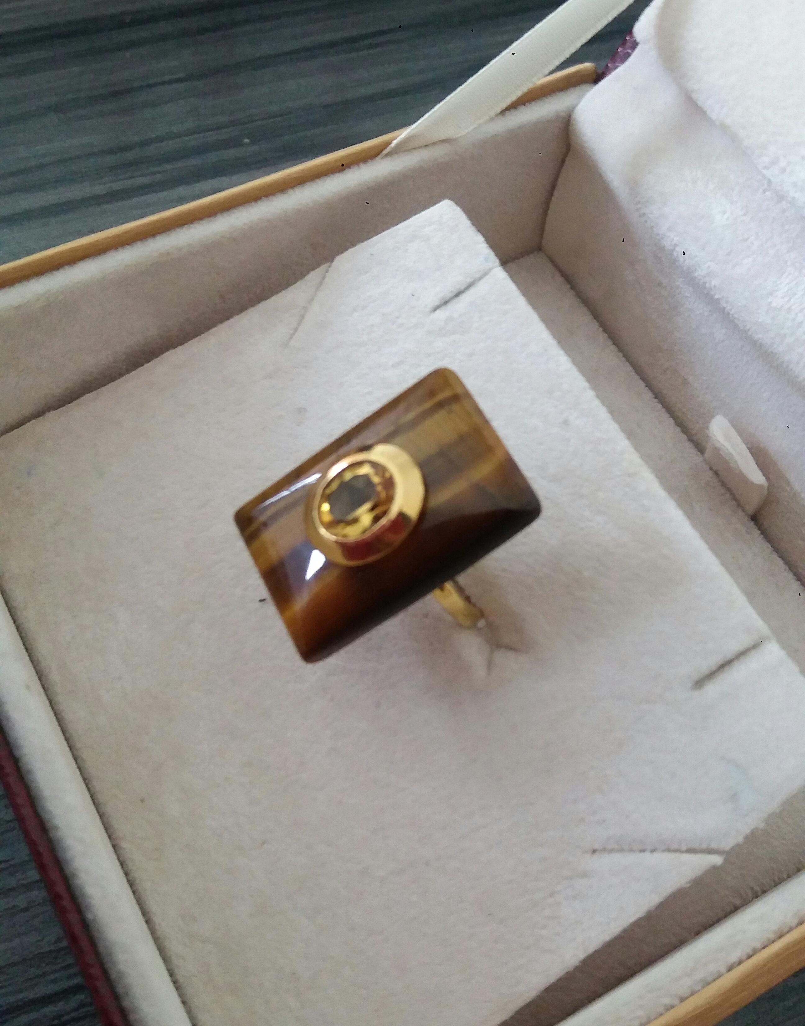 Unique ring with a Rectangular Shape Tiger Eye ,measuring 28 mm. x 20 mm x 6mm. and weighing 36 Carats with a nice Oval Faceted Yellow Citrine measuring 8 mm x 10 mm set in 14 kt yellow gold...Ring shank is also in 14 kt  solid yellow gold now in