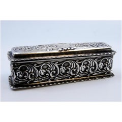 Rectangular silver box with reliefs and wavy friezes