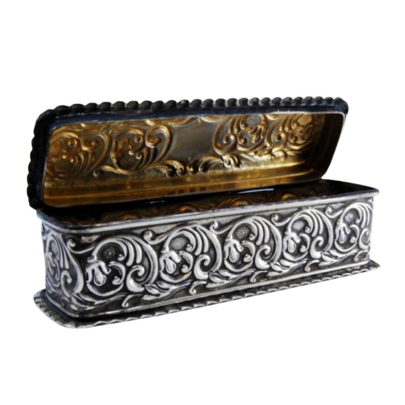 Rectangular silver box with reliefs and wavy friezes