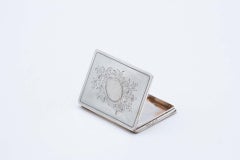 Rectangular silver card case with engraved floral motifs
