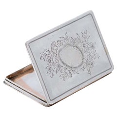 Rectangular silver card case with engraved floral motifs