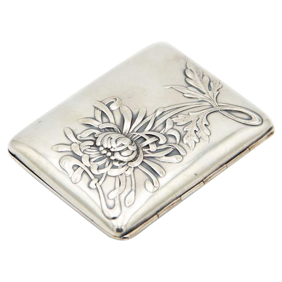 Rectangular silver case with embossed Art Nouveau floral motifs