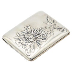 Rectangular silver case with embossed Art Nouveau floral motifs