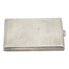 Rectangular silver cigarette case with engraved bands Rectangular silver cigarette case with engraved bands